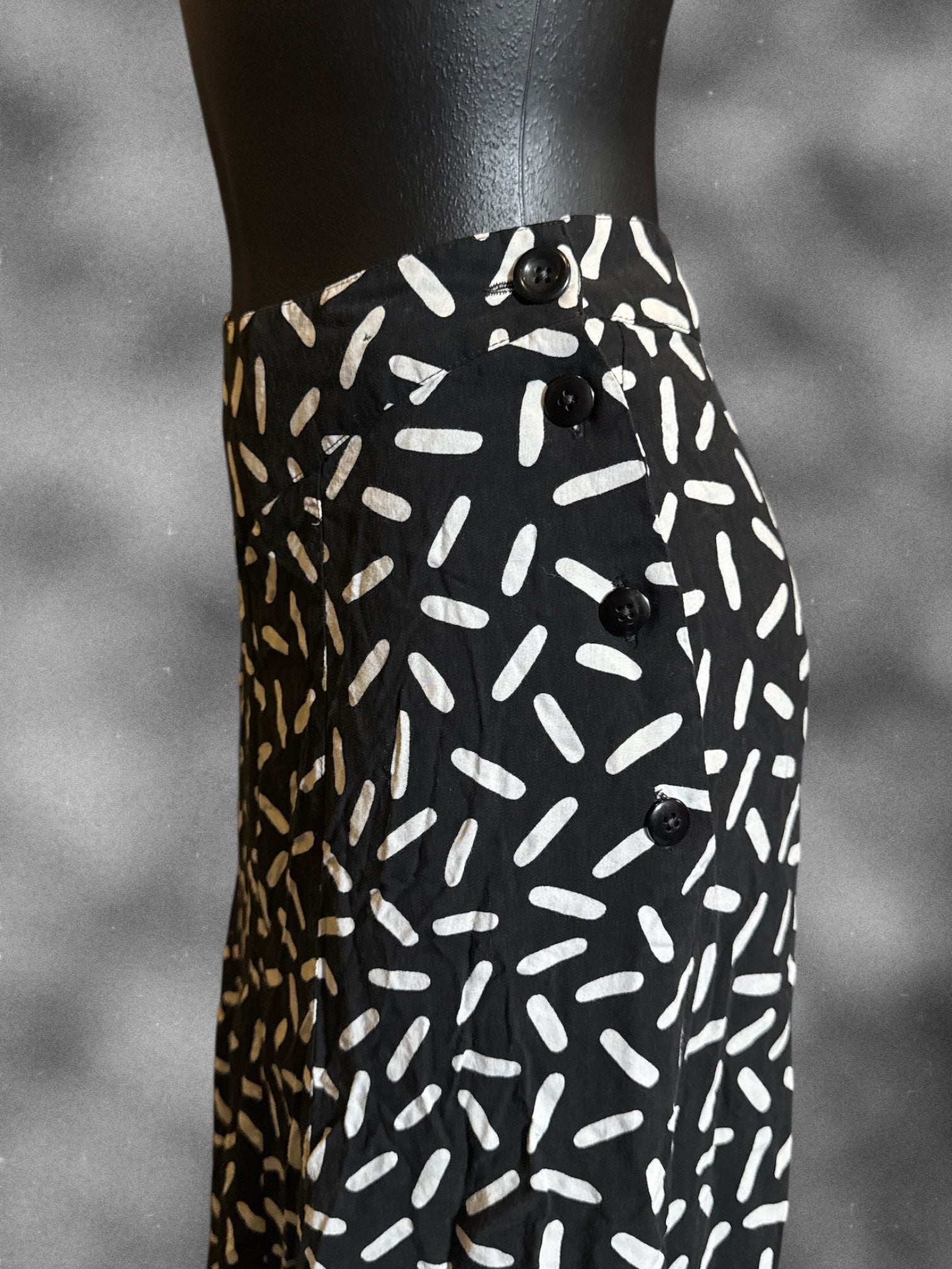 XS SK & Company vintage black midi skirt with white designs and side button closure