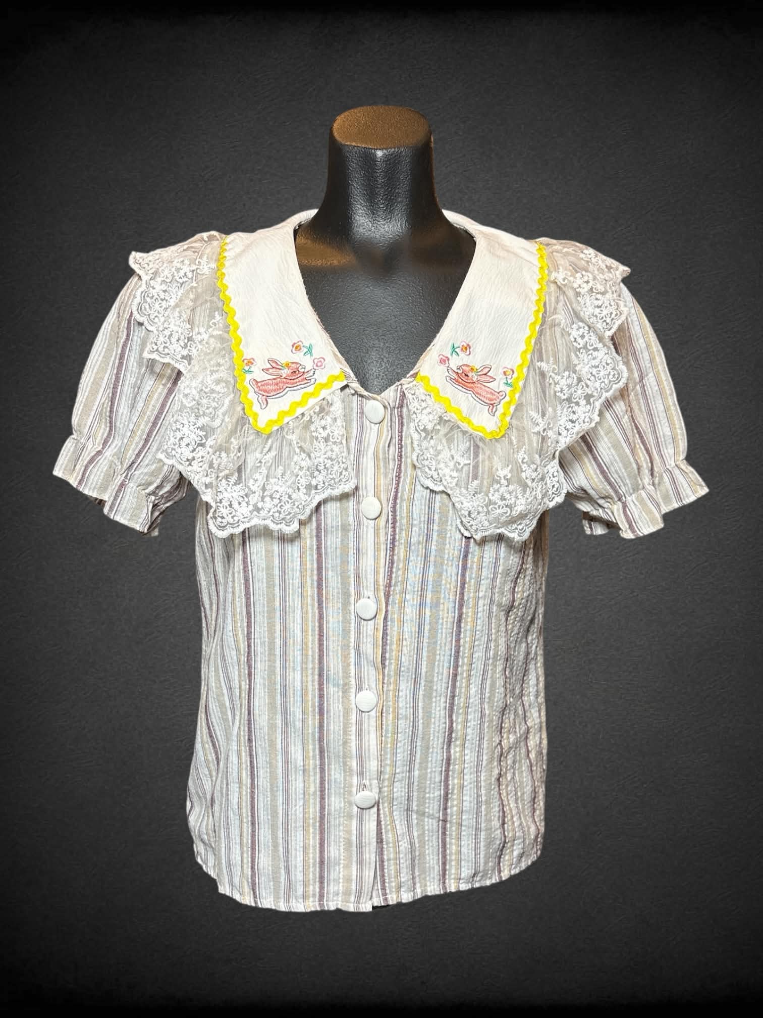 S I ❤️ Lucky white, tan, and brown striped short sleeve button up with lacey collar, and bunny embroidery on collar