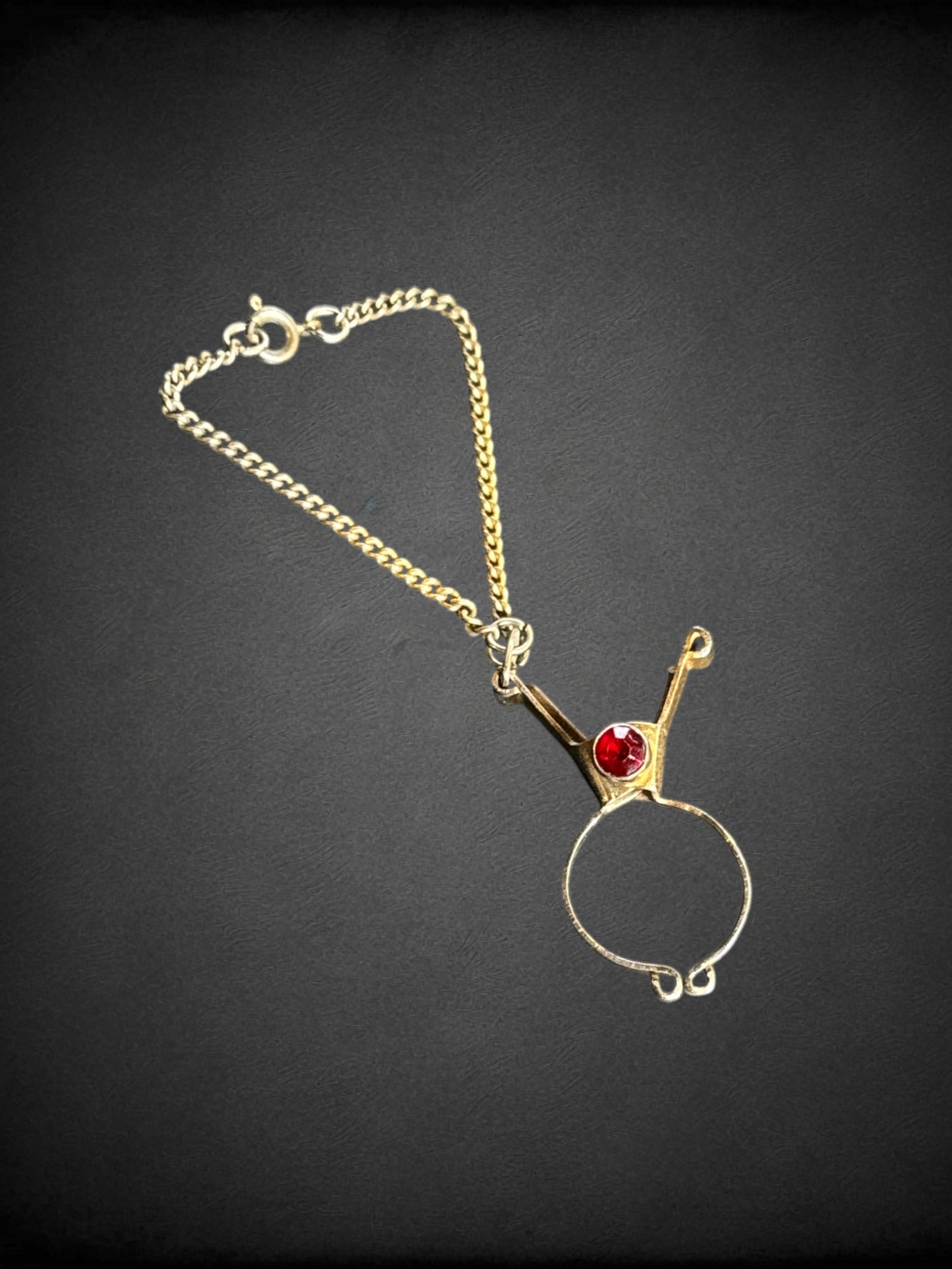 Vintage glove clip with red stone