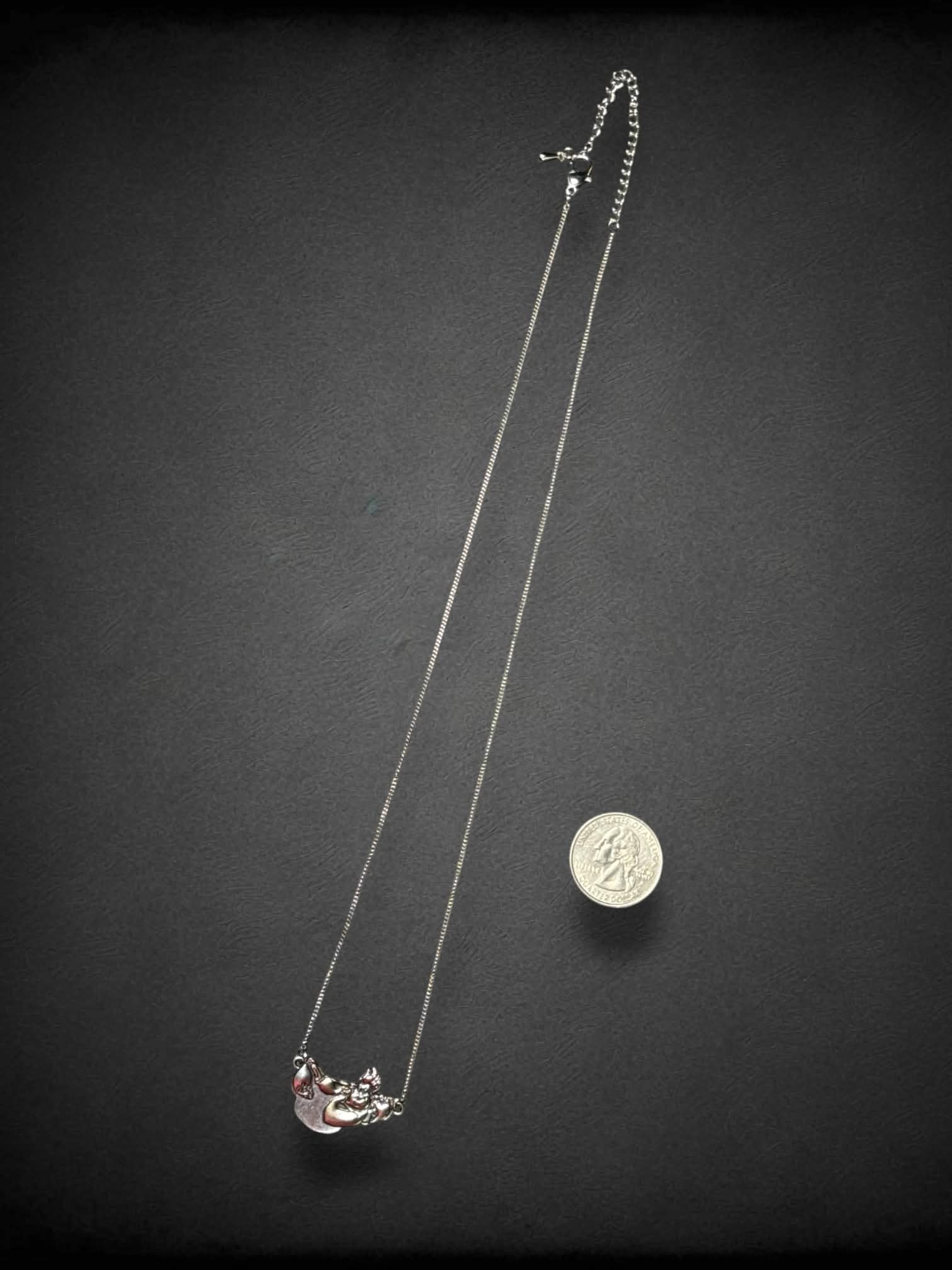 Silver tone necklace with Disney’s Ursula, Flotsam, and Jetsam