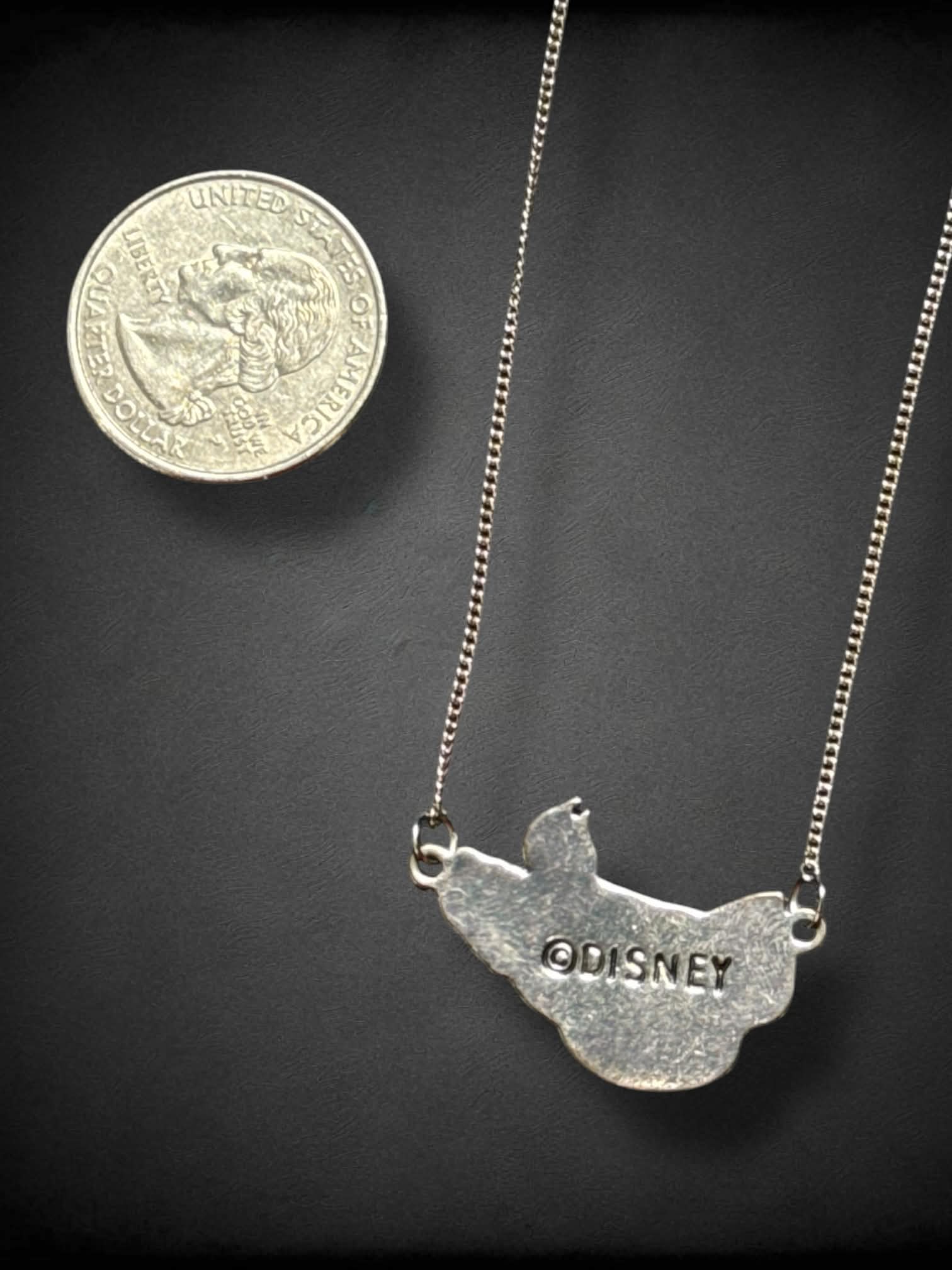 Silver tone necklace with Disney’s Ursula, Flotsam, and Jetsam