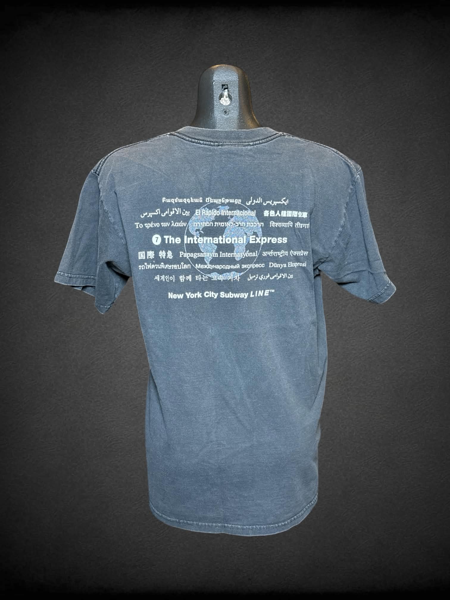 M NYC Subway Line black t shirt with “7, Manhattan to Queens” graphic