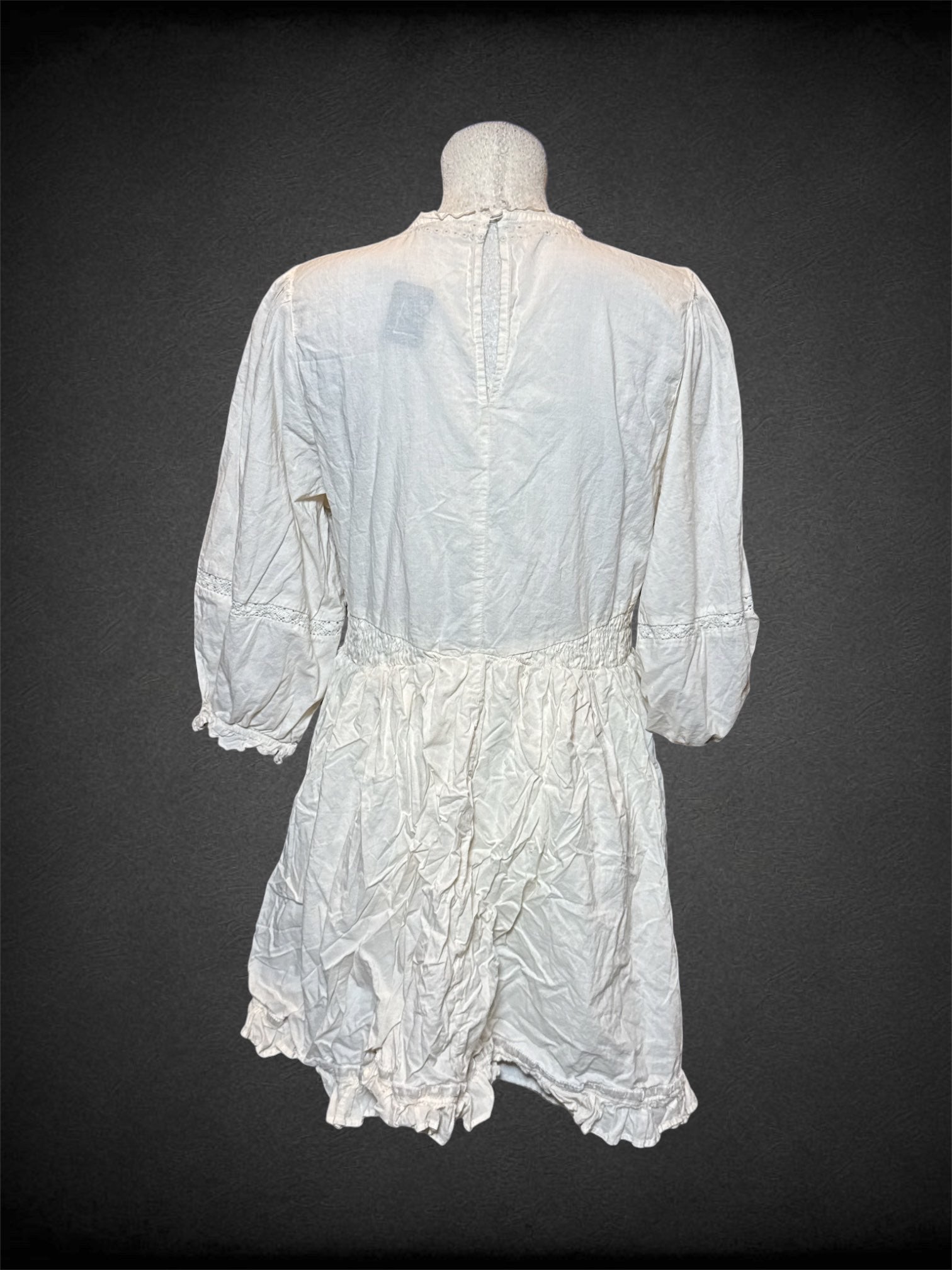 L American Eagle white half sleeve dress with floral designed eyelets, and keyhole/button on back