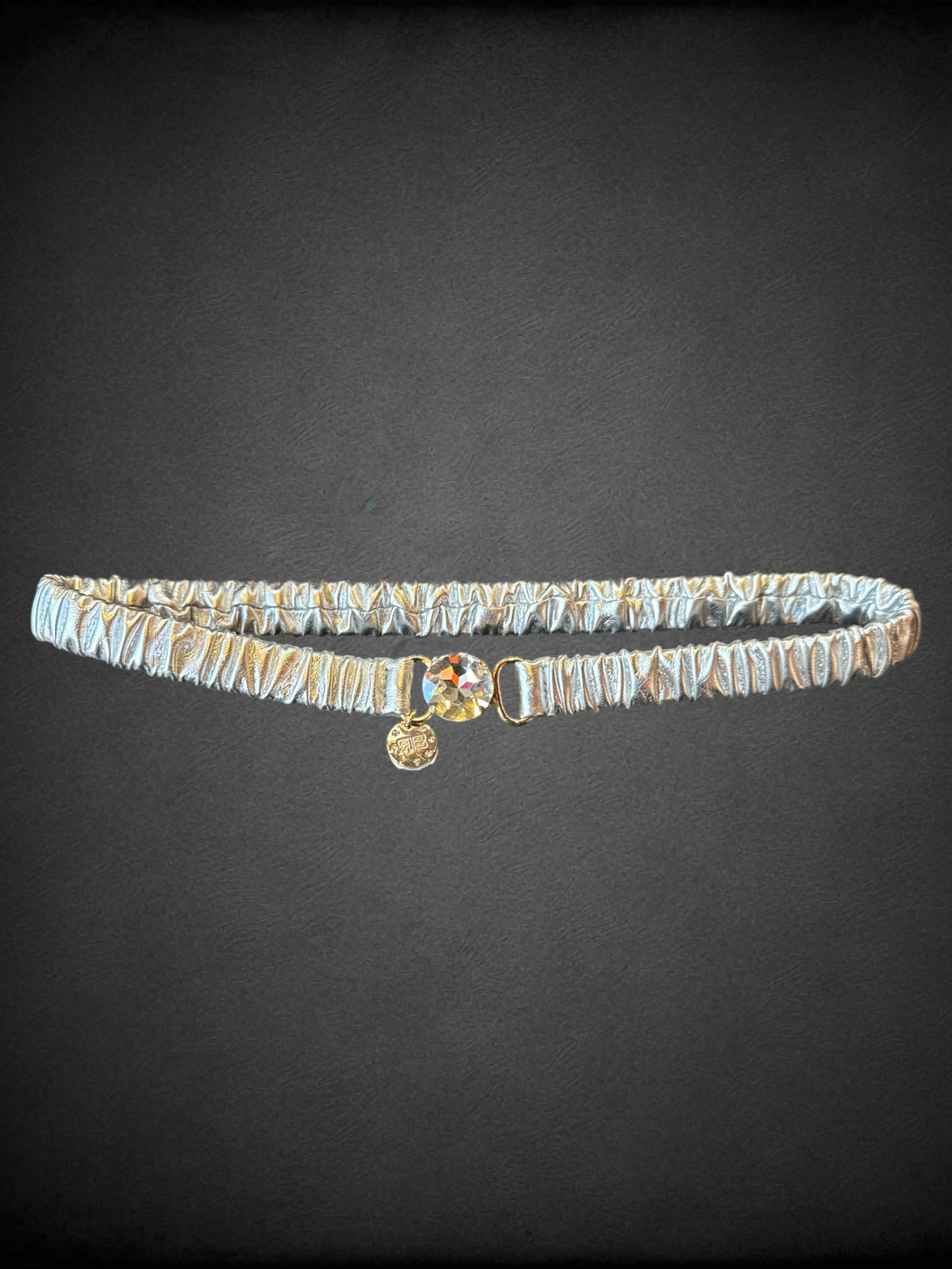 L The Sandro elastic metallic leather belt in silver with gem