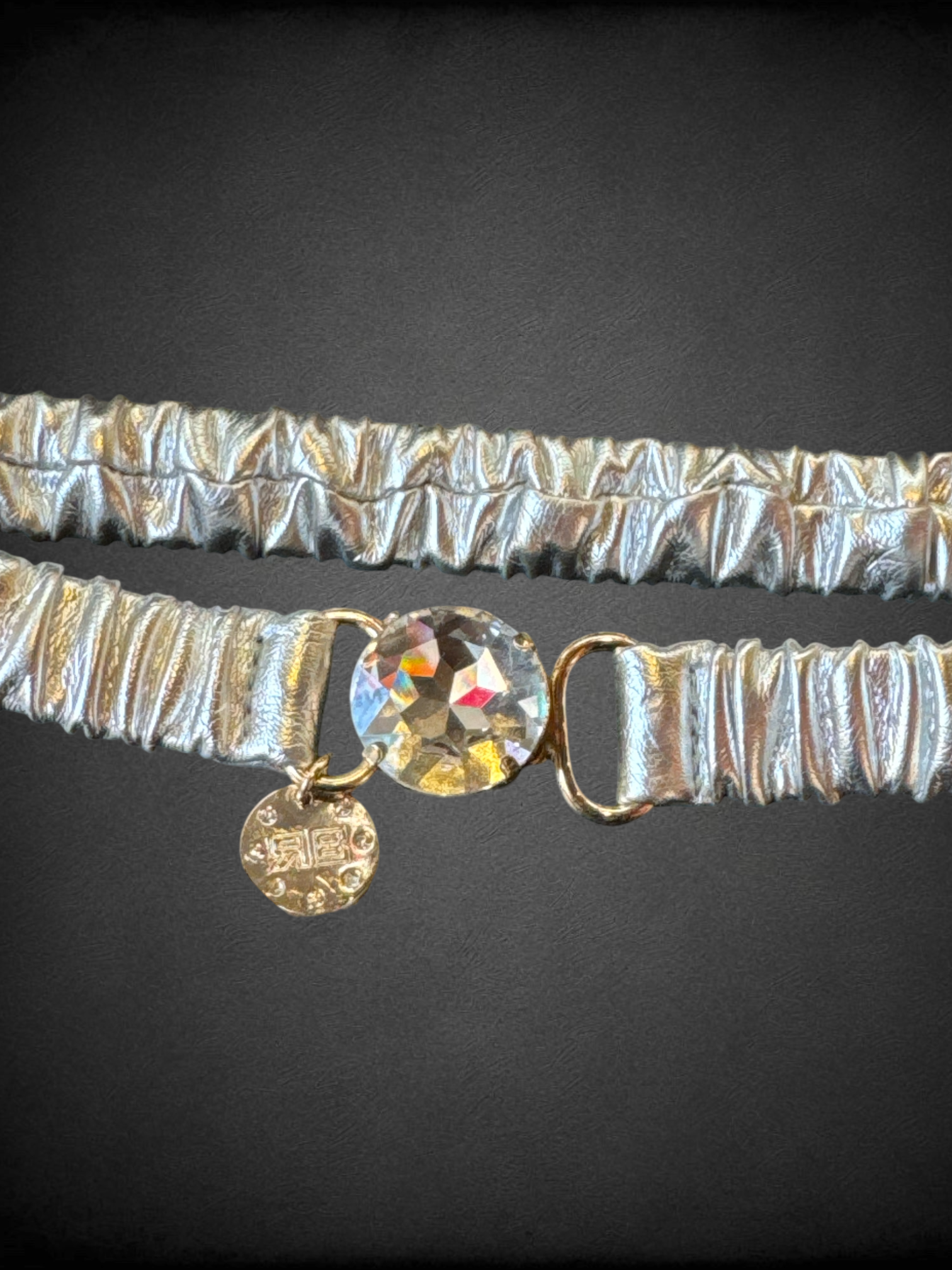L The Sandro elastic metallic leather belt in silver with gem