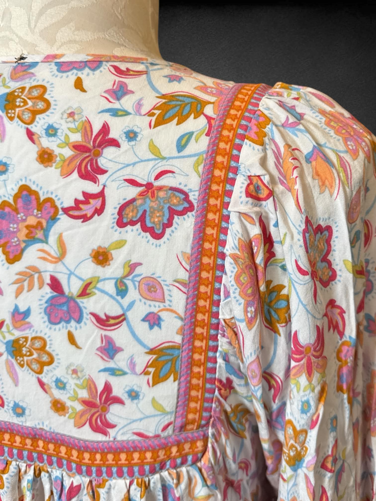 1X Rachel Zoe white long sleeve top with pink and orange paisley design, tie on front, and balloon sleeves