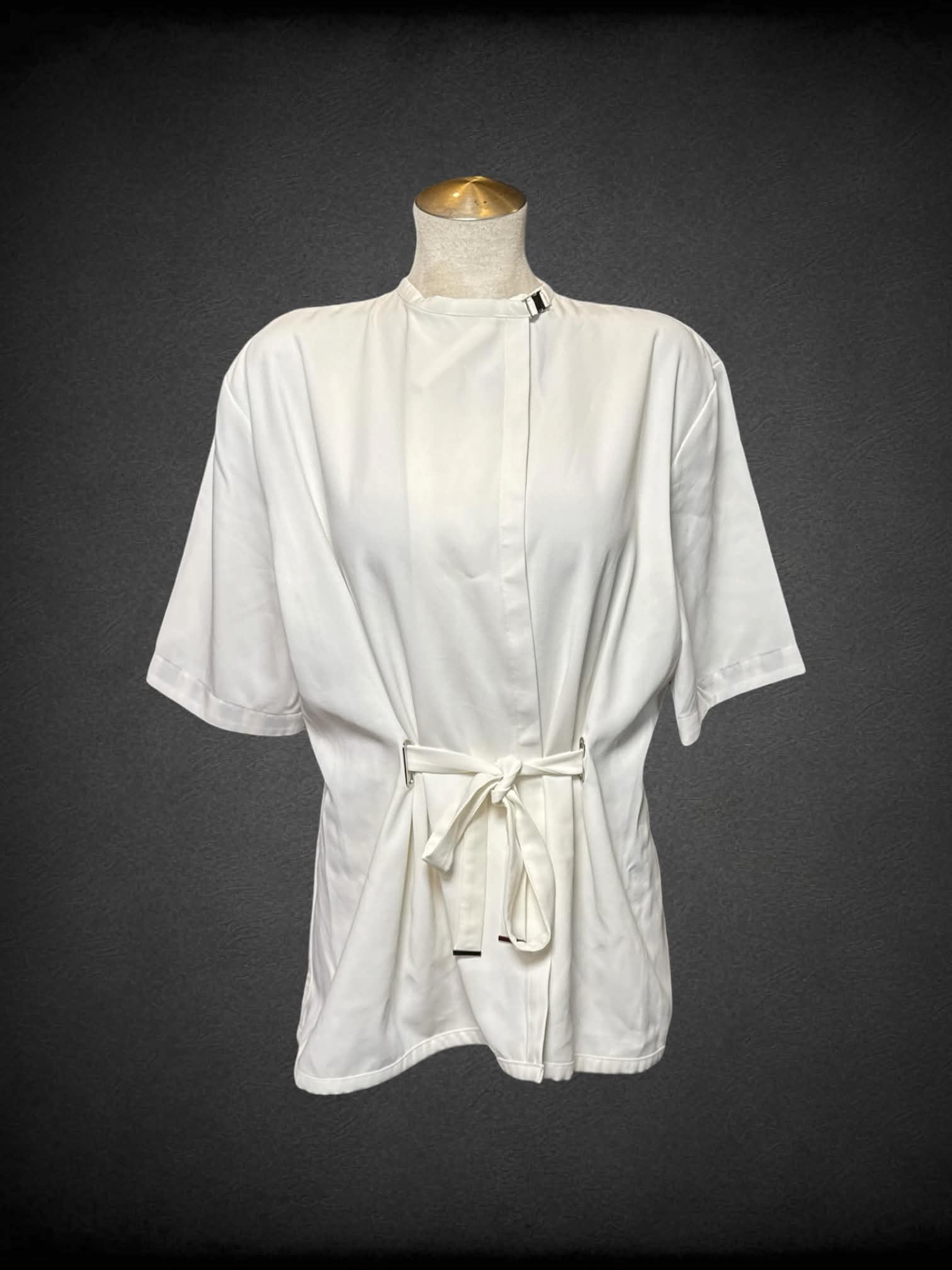 L NotEqual Anoro white wrap top with buckle on neck, and black and white striped back lining