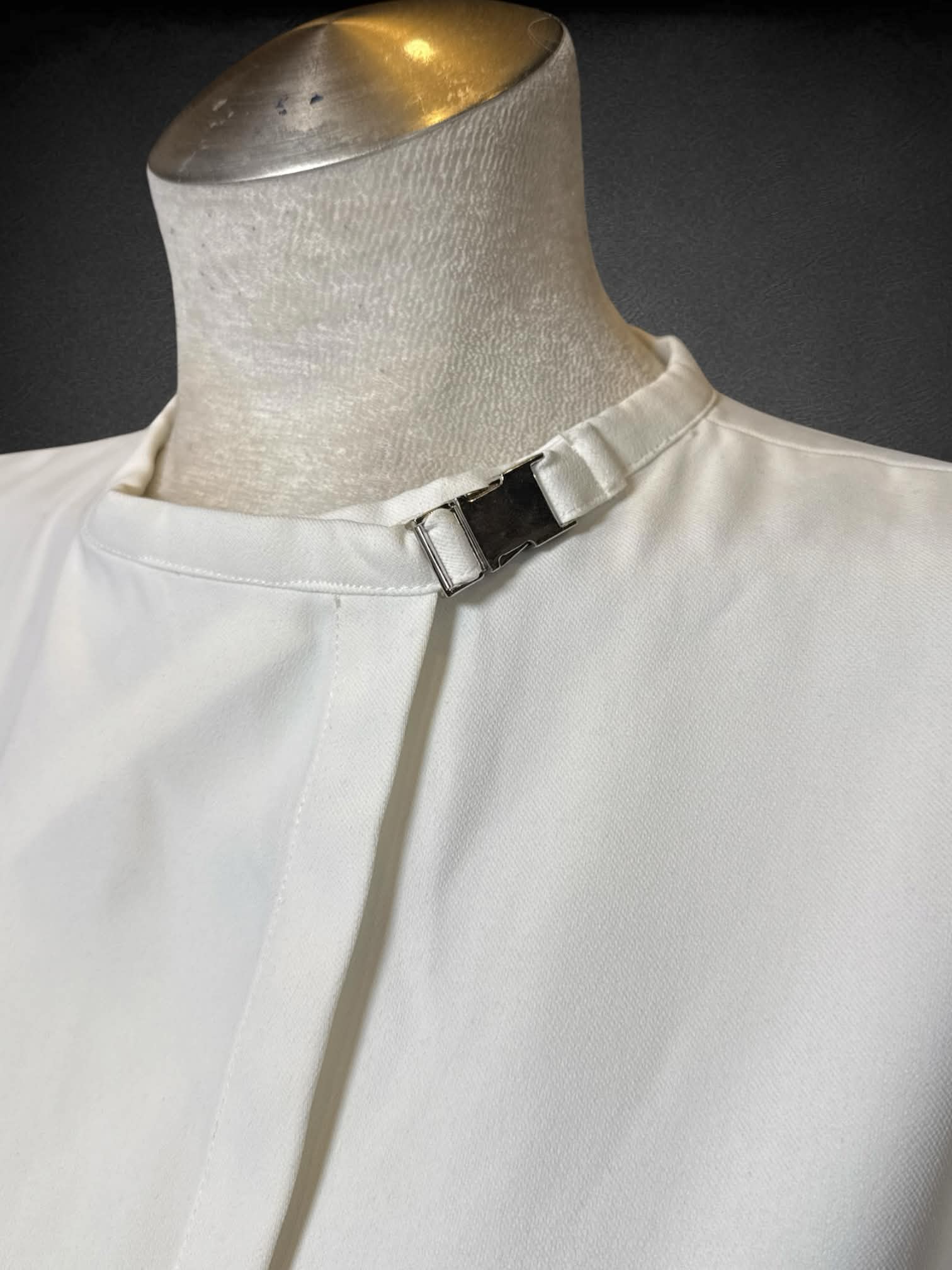 L NotEqual Anoro white wrap top with buckle on neck, and black and white striped back lining