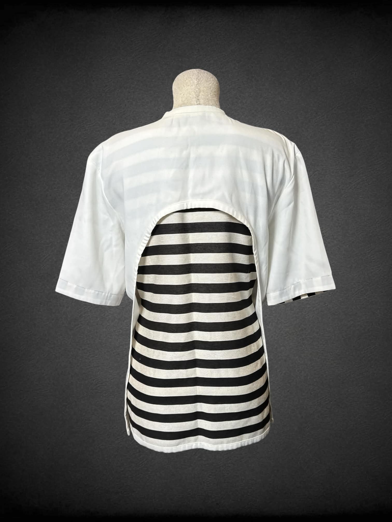 L NotEqual Anoro white wrap top with buckle on neck, and black and white striped back lining