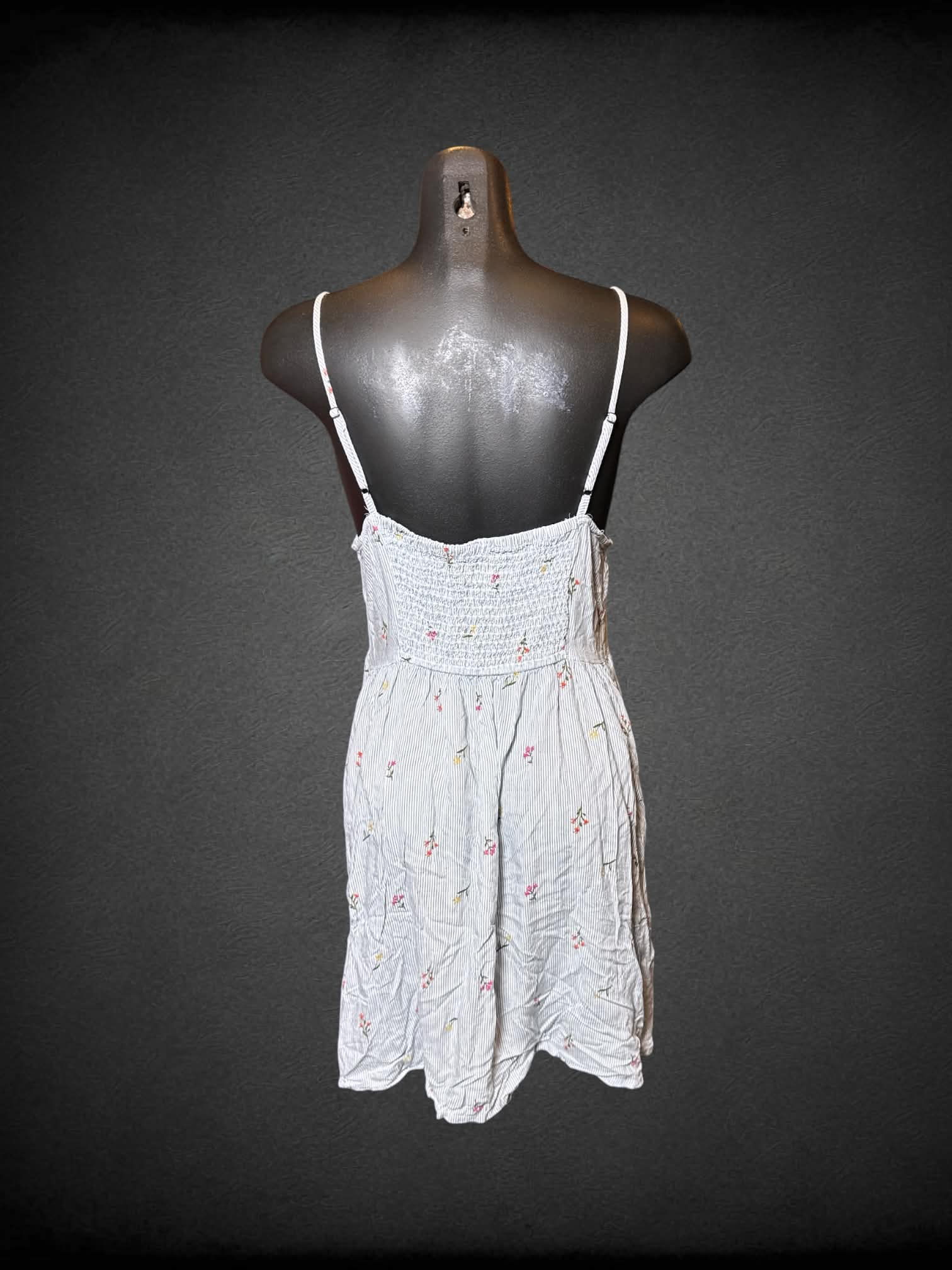 M So white sleeveless dress with blue stripes, florals, and shirred back