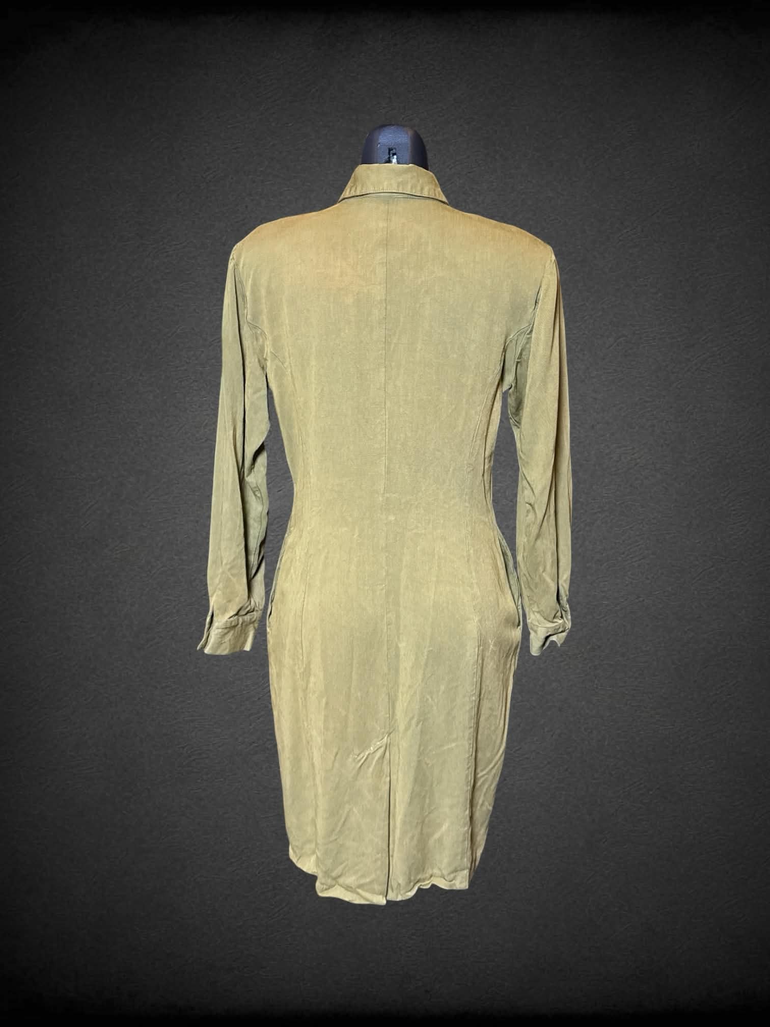 M WildRose green long sleeve button up dress with black ornate embroidery on front, and pockets