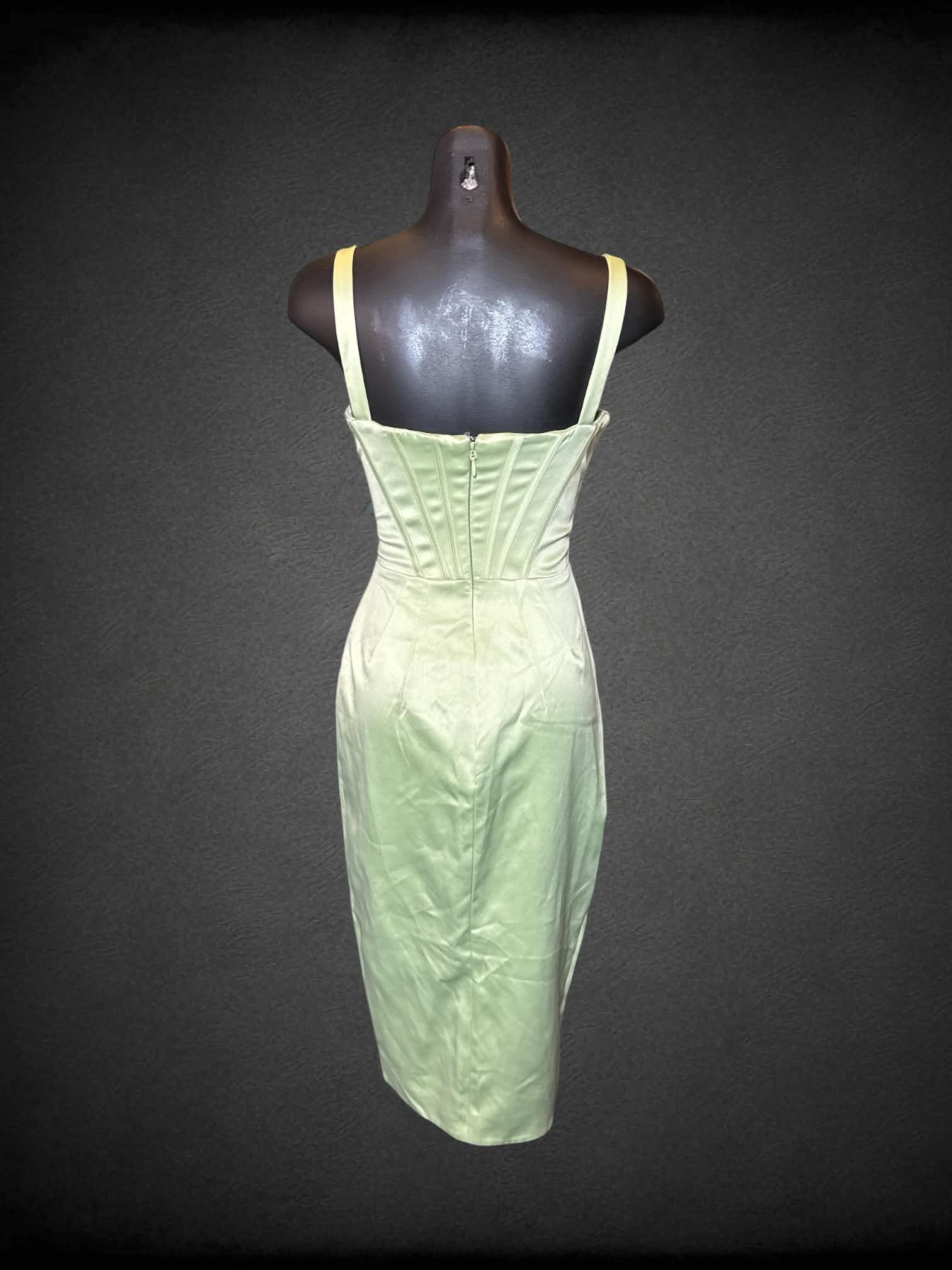 XS House of CB light green sleeveless dress with boning, low cut neckline, zipper/clasp on back, and wrap design on front