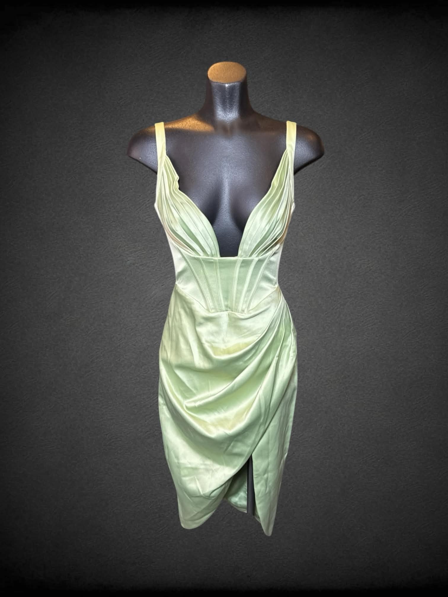 XS House of CB light green sleeveless dress with boning, low cut neckline, zipper/clasp on back, and wrap design on front
