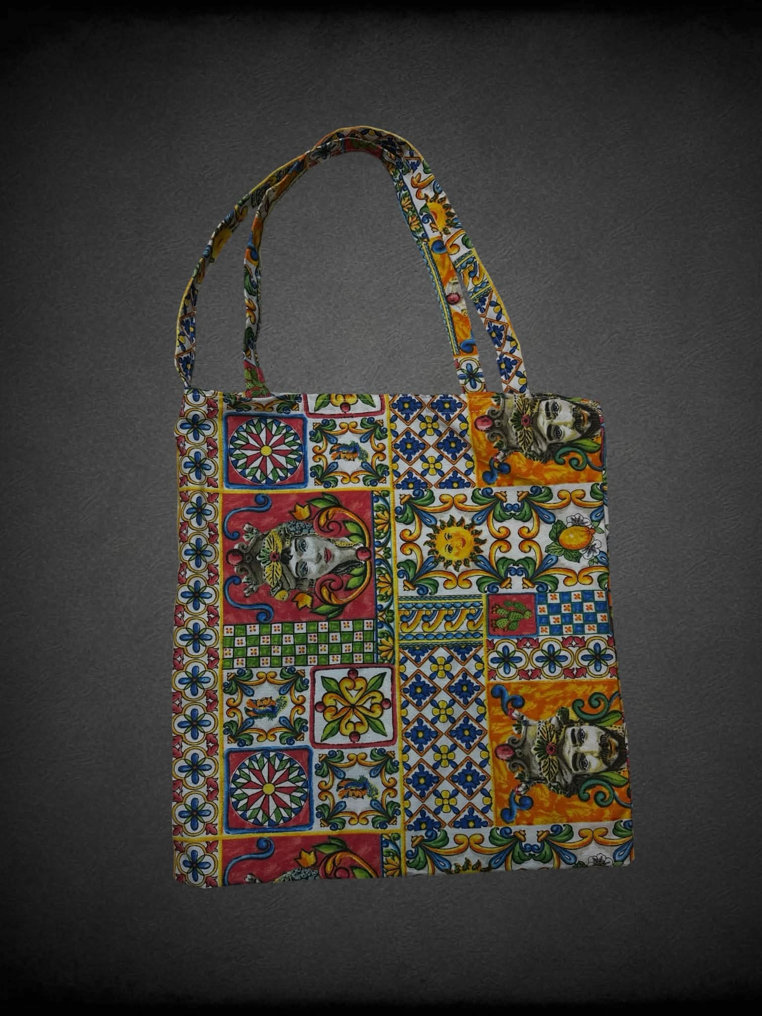Colorful canvas tote bag with decorative quilt-like design