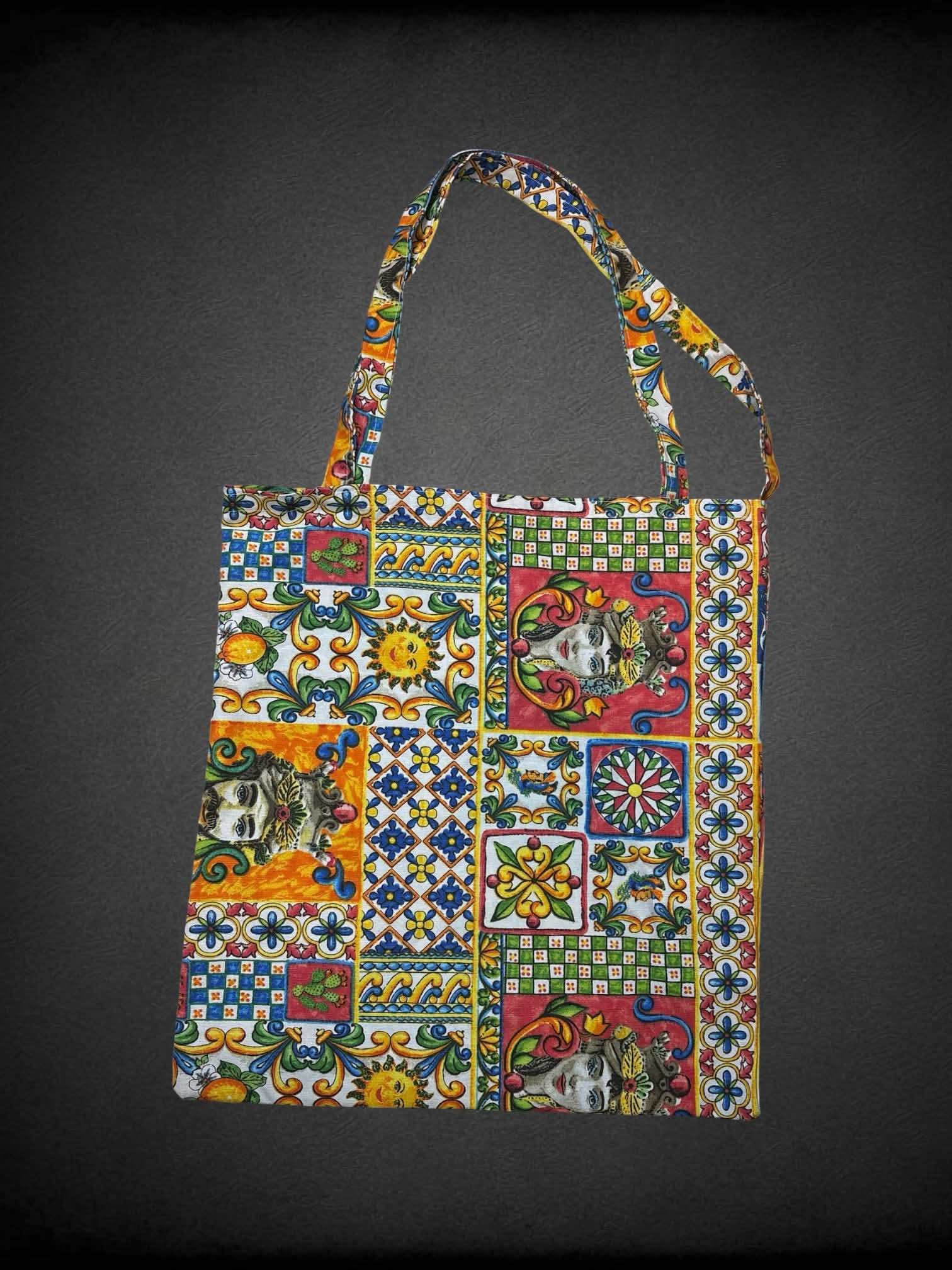 Colorful canvas tote bag with decorative quilt-like design