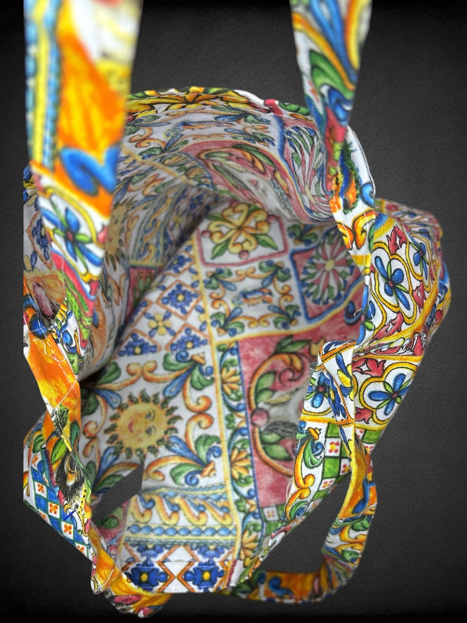 Colorful canvas tote bag with decorative quilt-like design