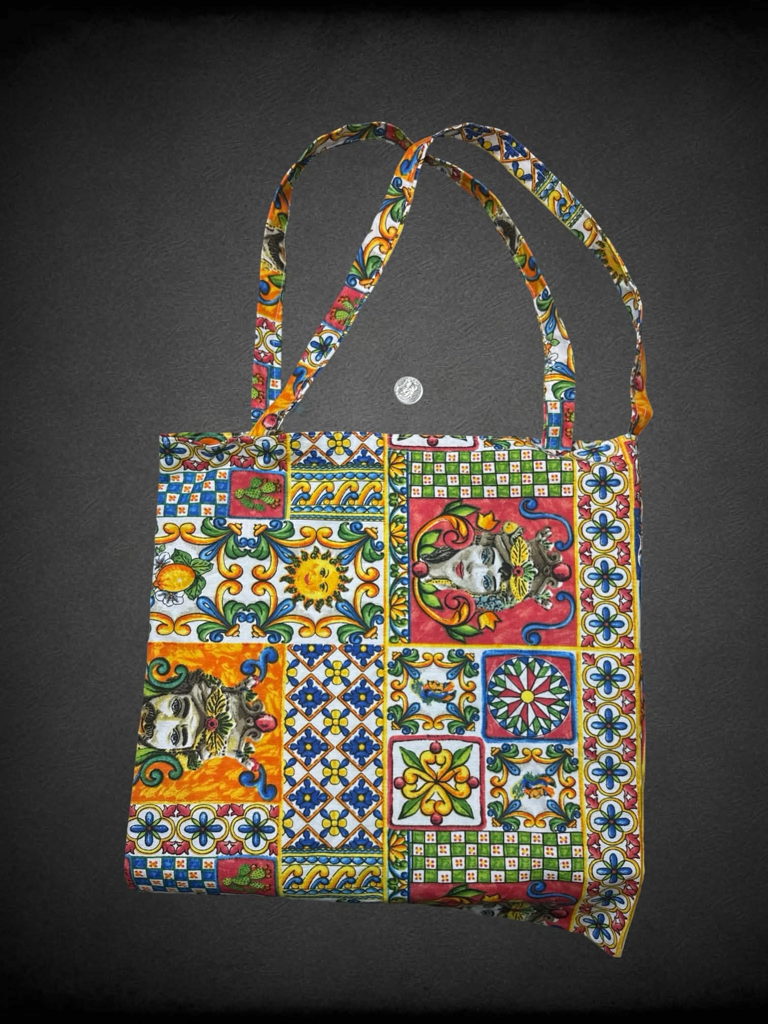 Colorful canvas tote bag with decorative quilt-like design