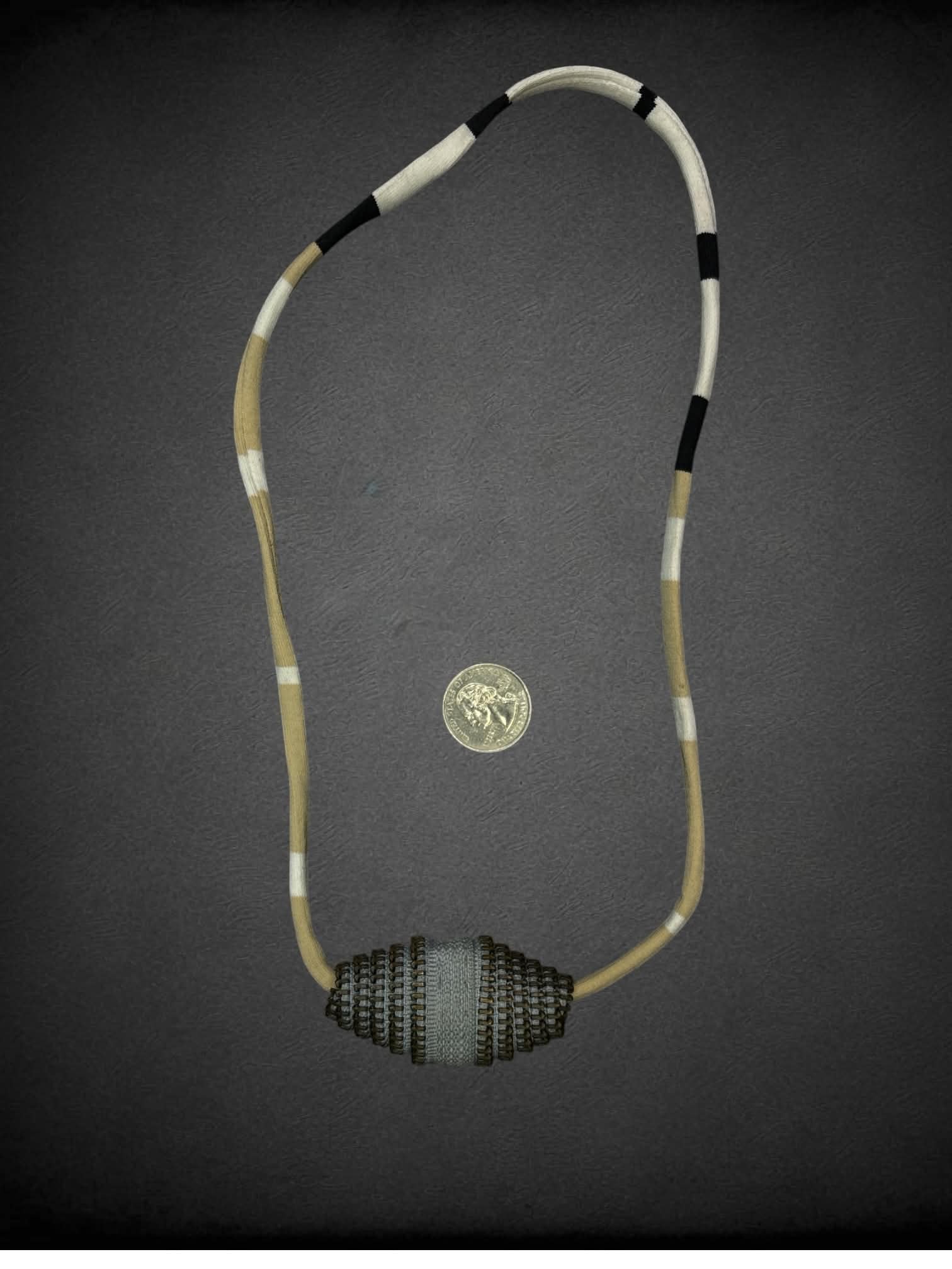 Hand-made necklace with recycled zipper ends and vintage cord trim