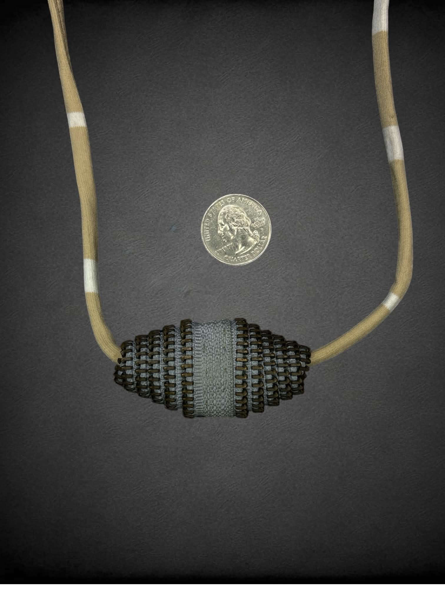 Hand-made necklace with recycled zipper ends and vintage cord trim