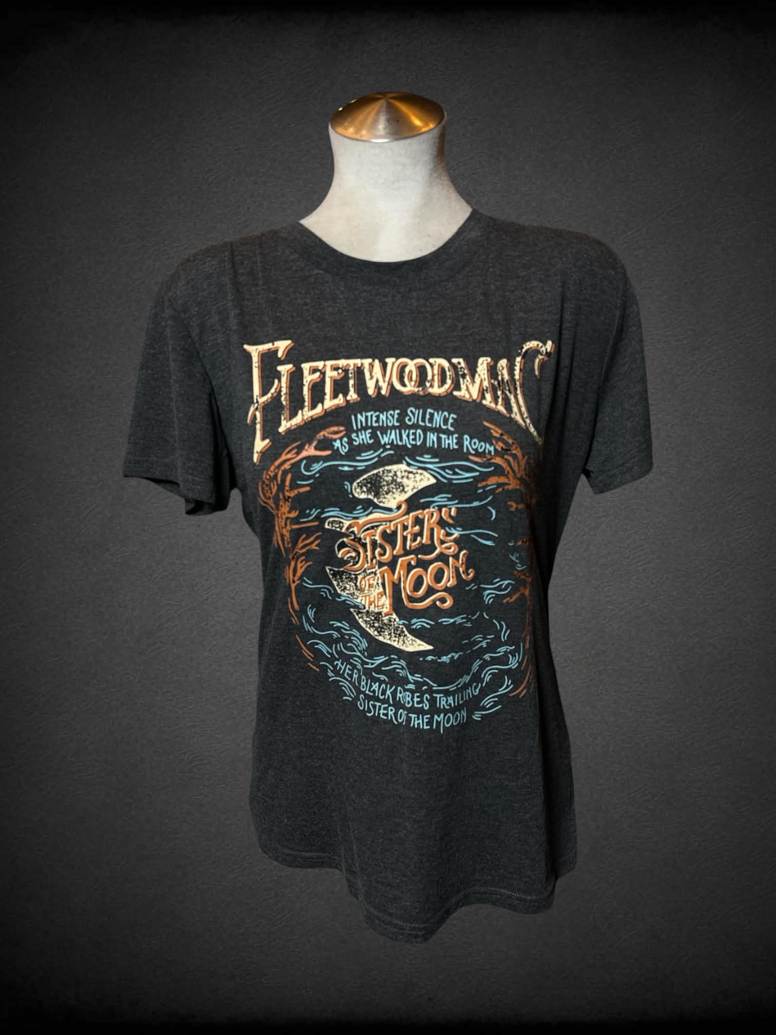 L grey t shirt with “Fleetwood Mac-Sisters of the Moon” graphic on front