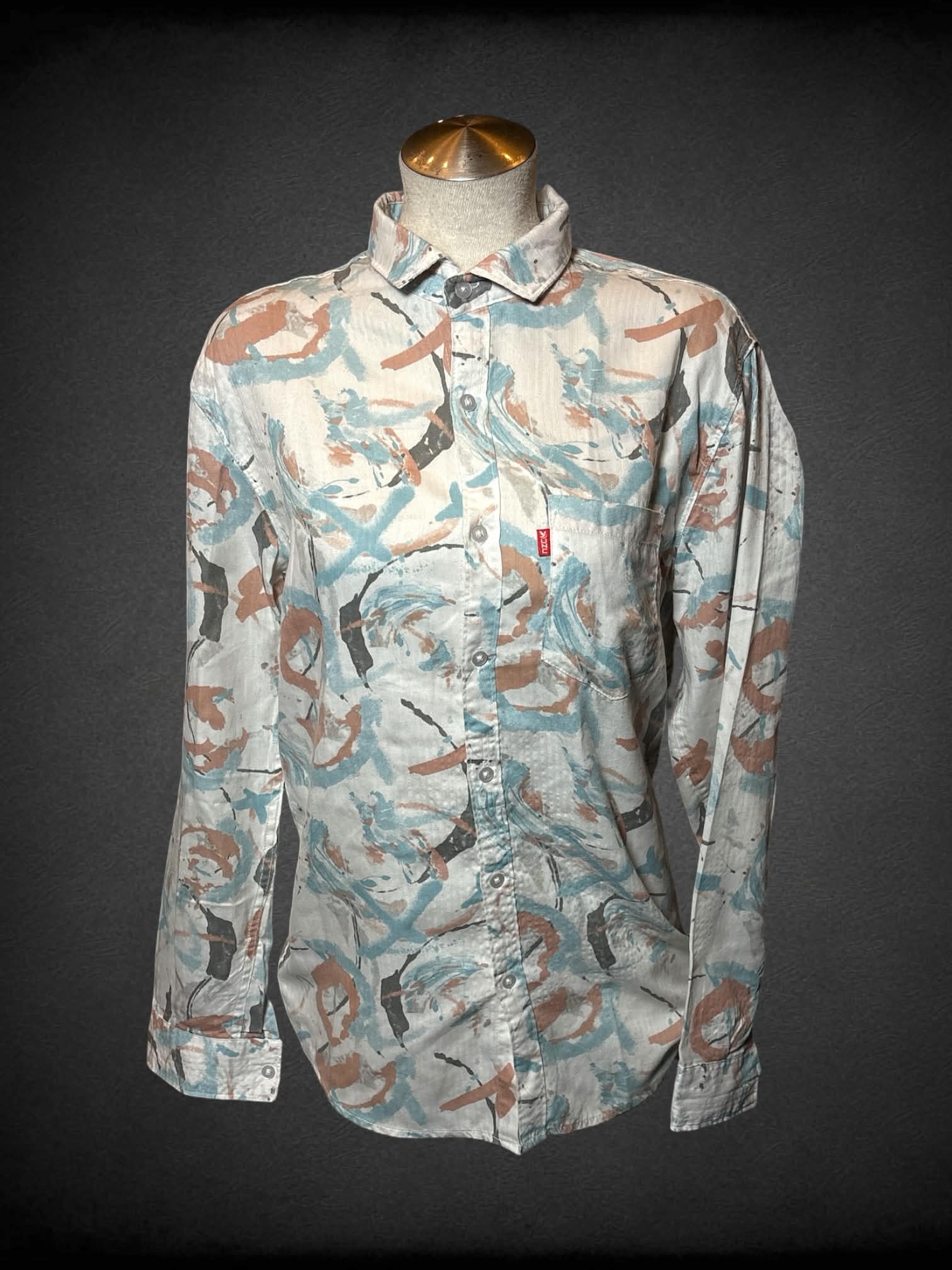L Unc white button up shirt with blue, brown and pale orange paint stroke pattern