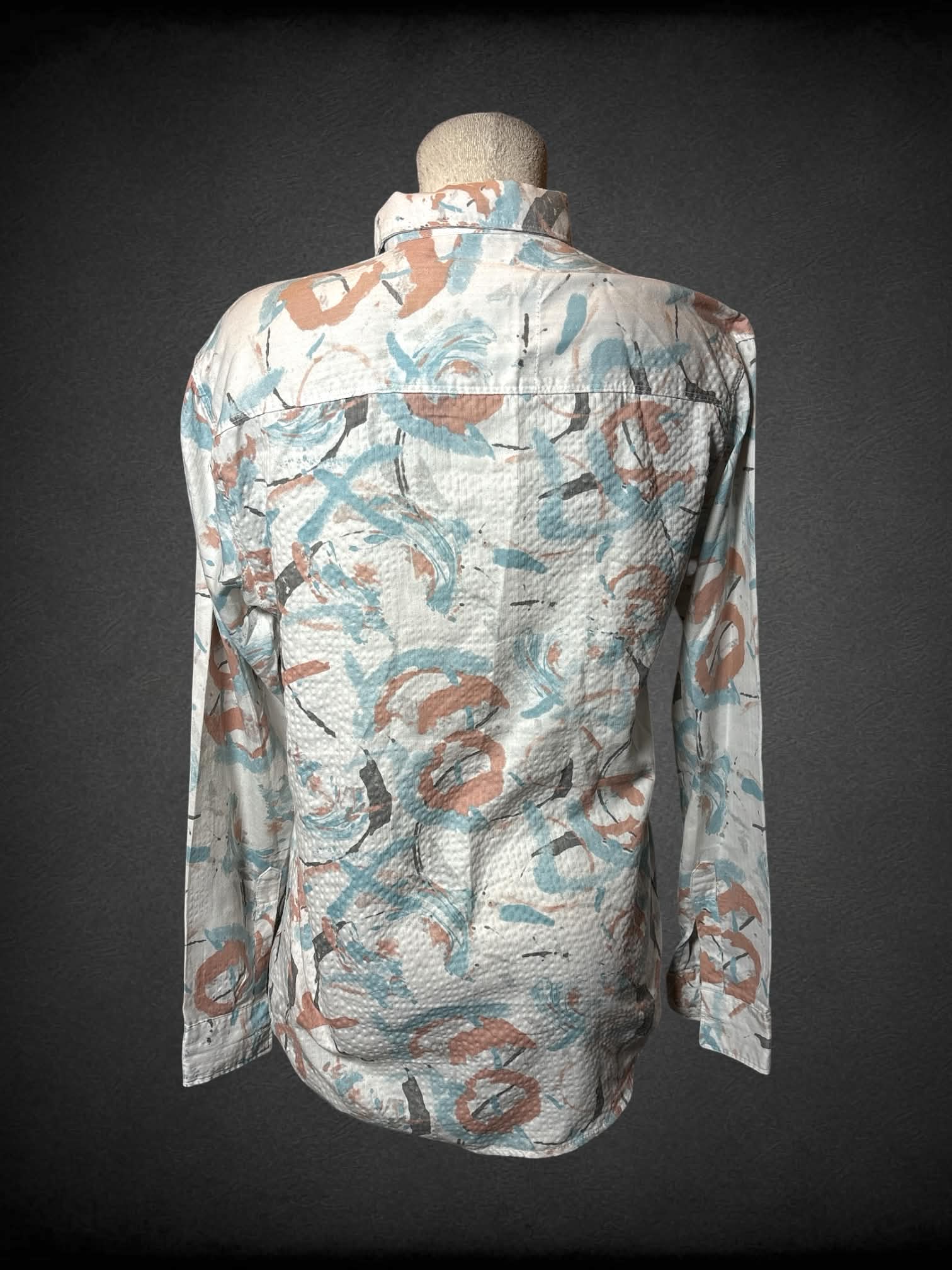 L Unc white button up shirt with blue, brown and pale orange paint stroke pattern
