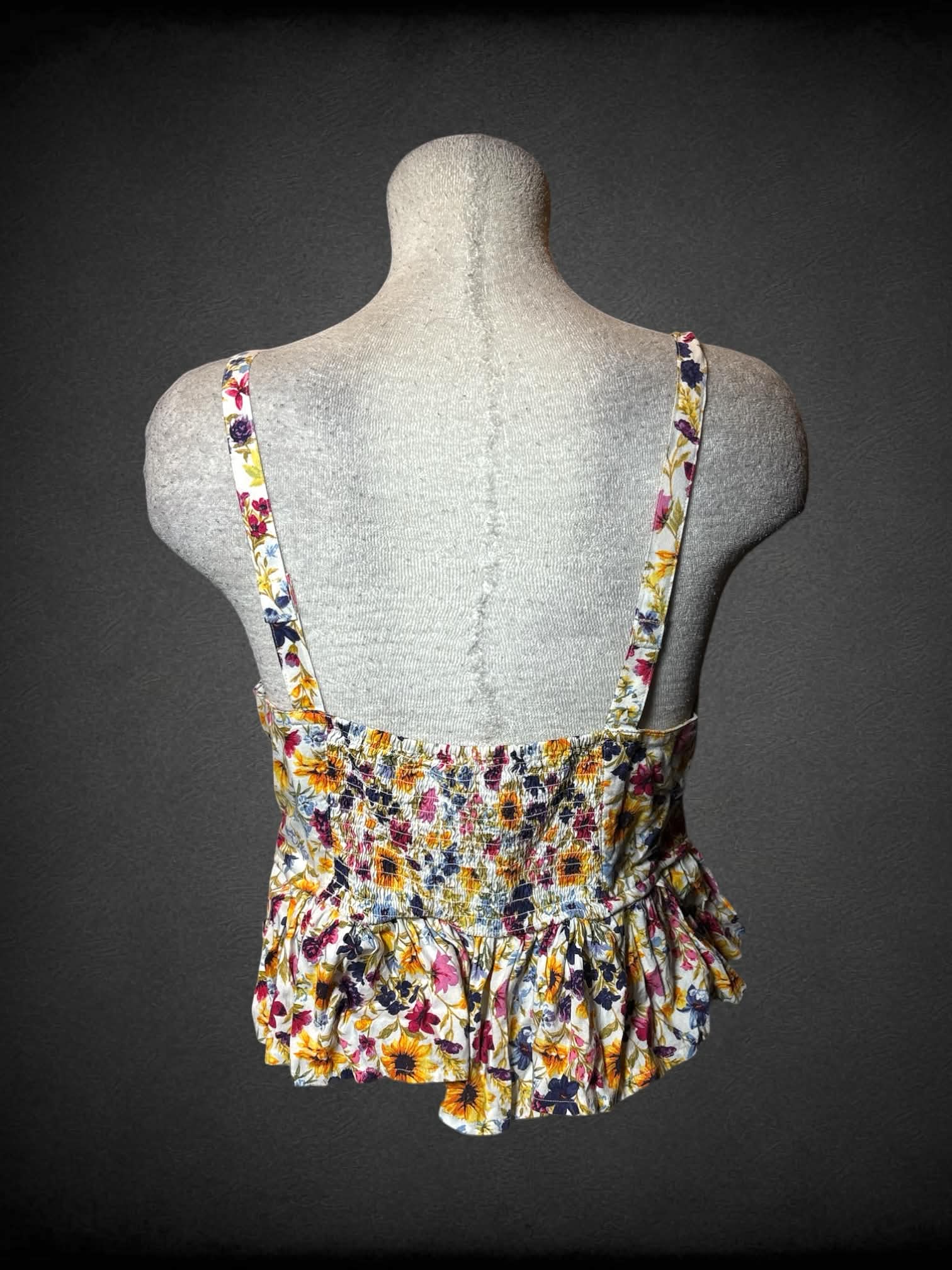 L Old Navy white cropped cami with colorful floral pattern, ruffled bottom and shirred back