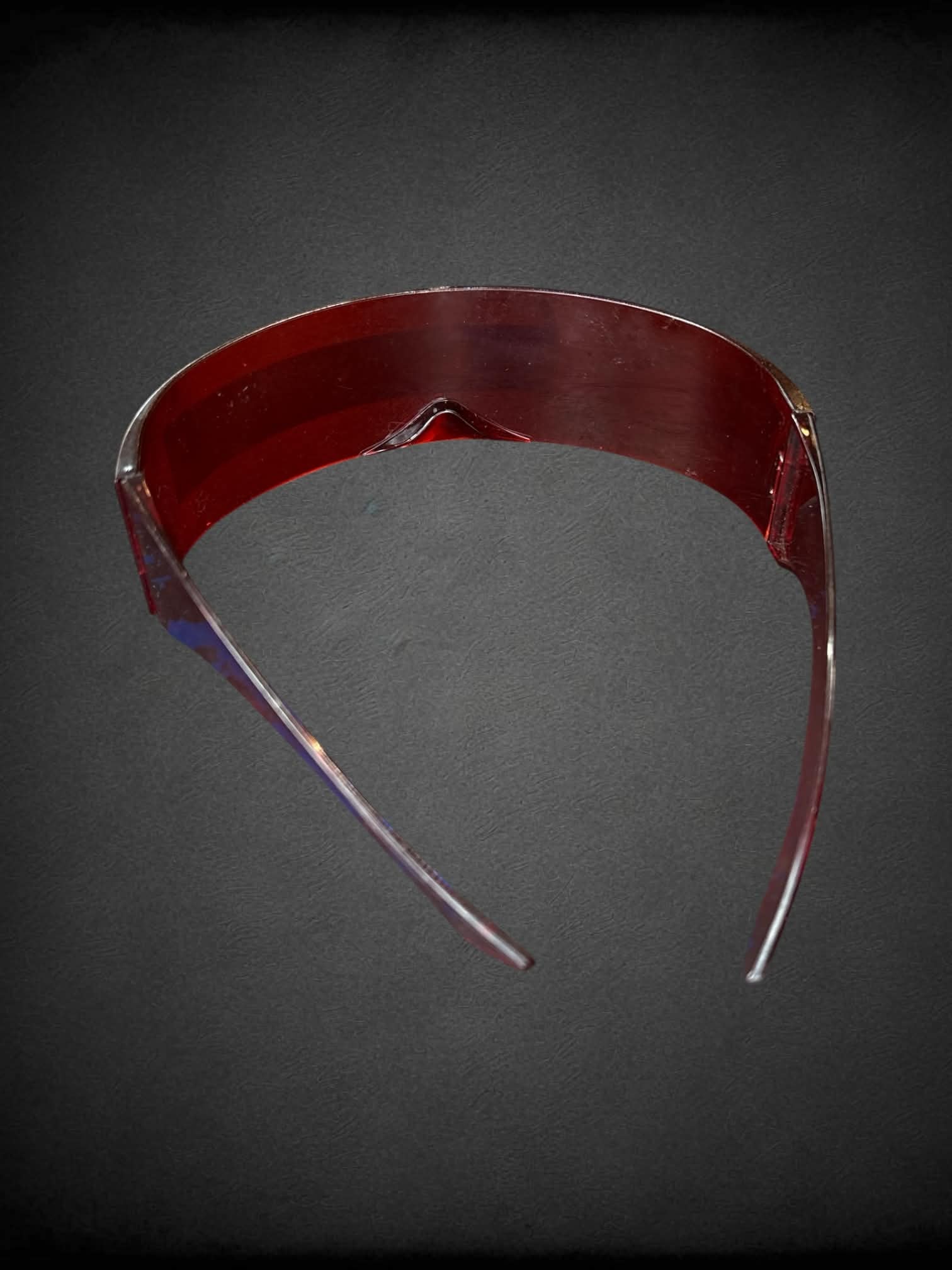 Red futuristic sunglasses with reflective mirror on front