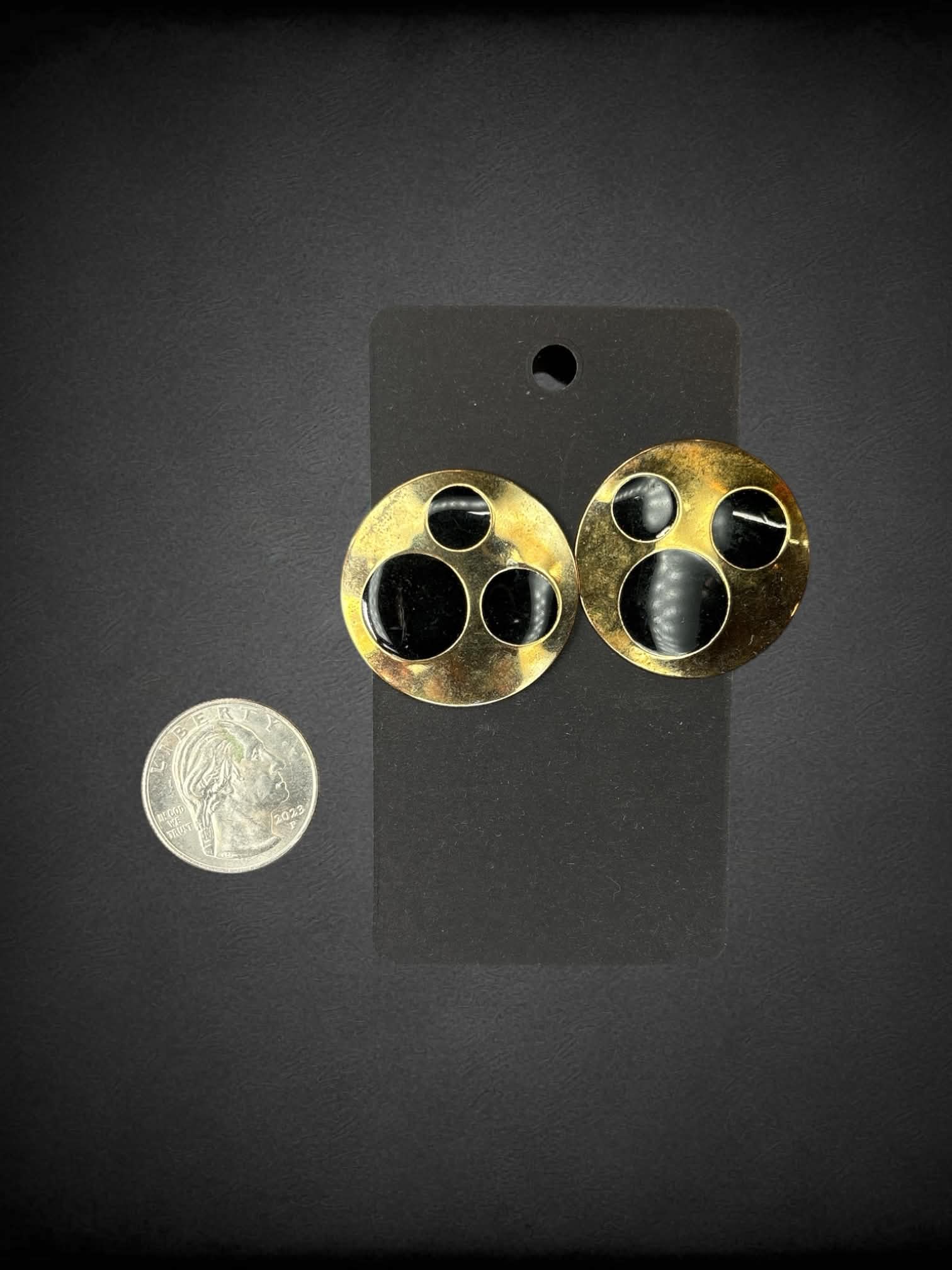 Circular bronze earrings with black circular design
