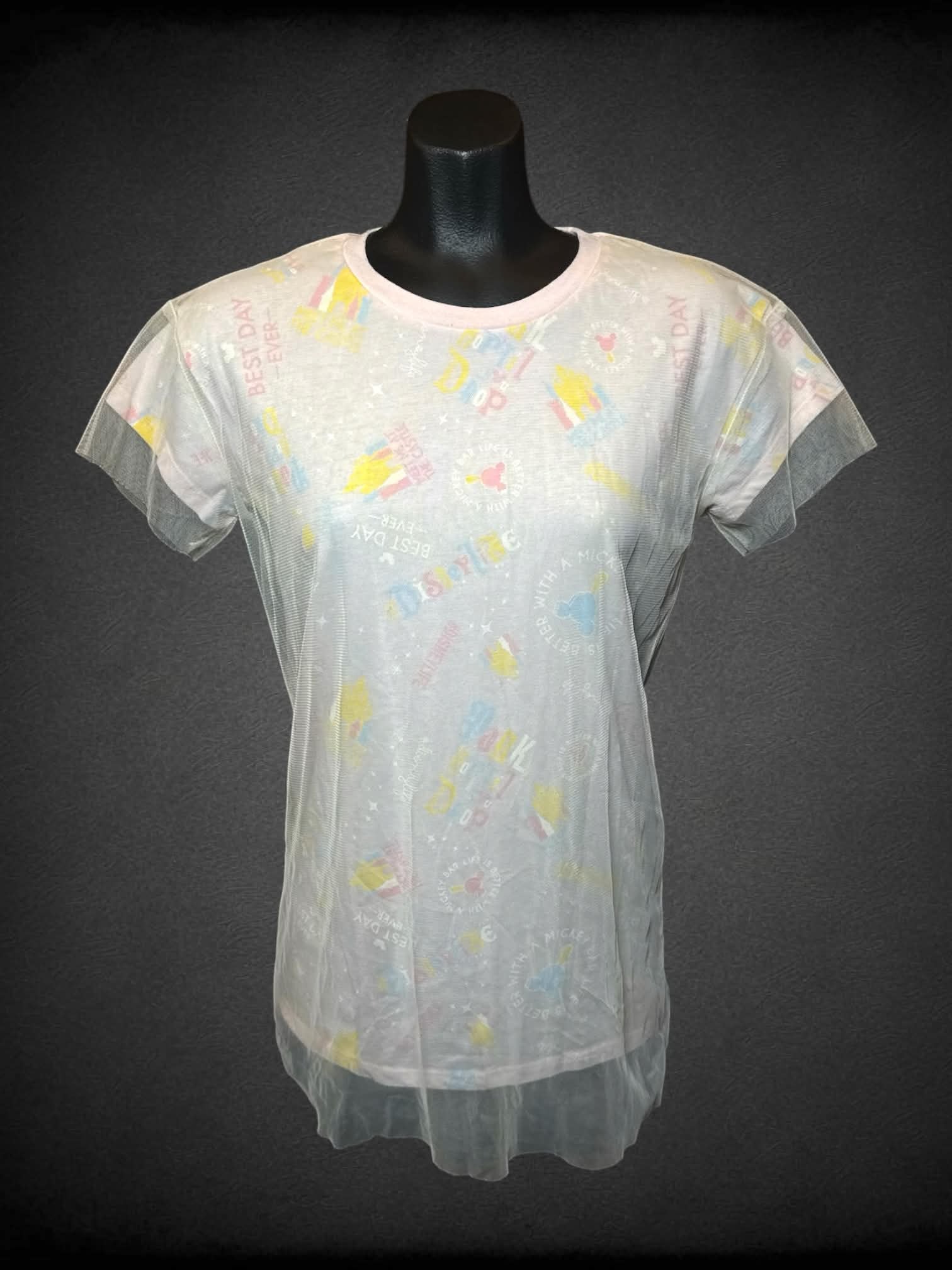 S Disney Parks pastel pink t shirt with “Disney Parks” design, and sheer tulle-like overlayer