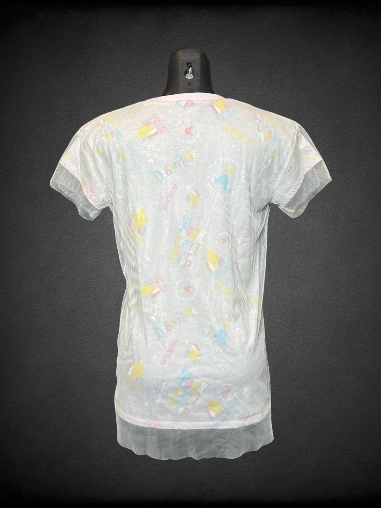 S Disney Parks pastel pink t shirt with “Disney Parks” design, and sheer tulle-like overlayer