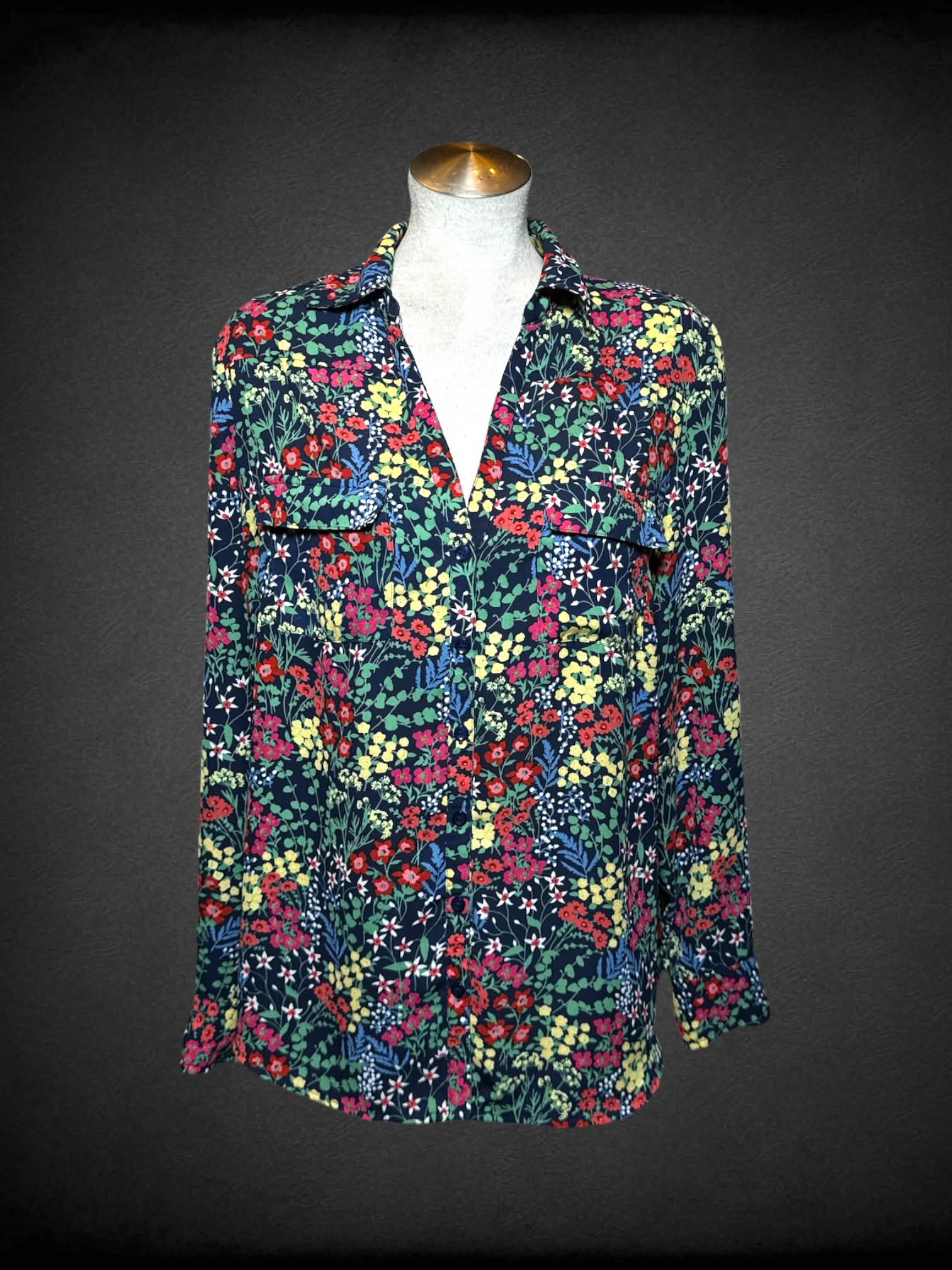 L New York & Company black button-up blouse with colorful floral pattern, and pockets on front