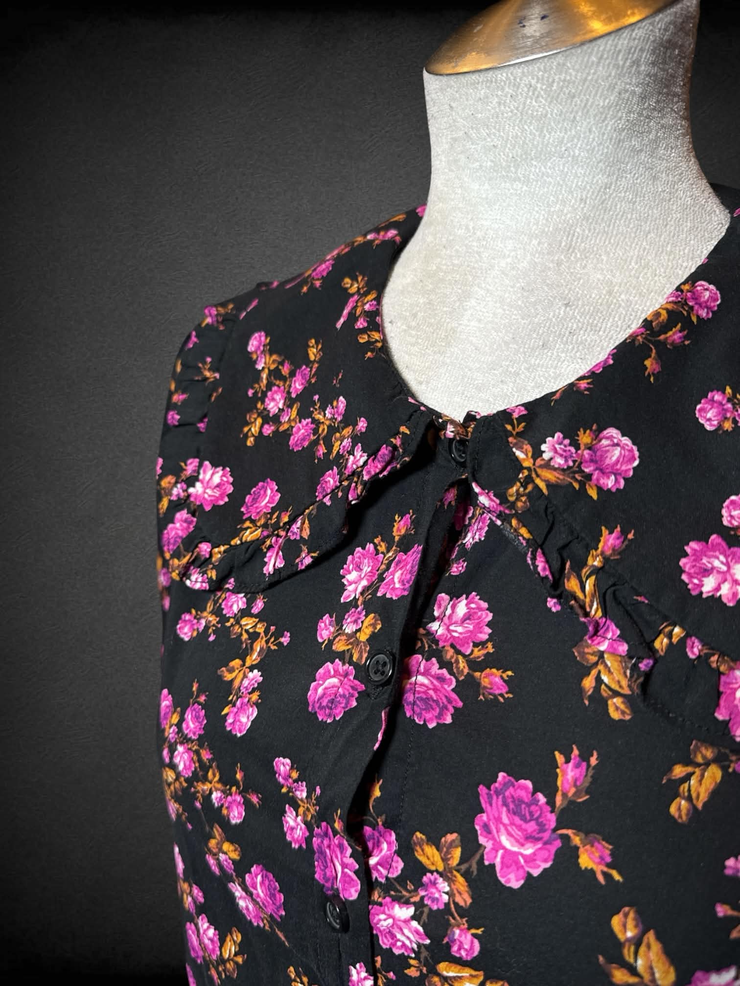 L Who What Wear black button-up blouse with pink floral pattern, and Peter Pan collar