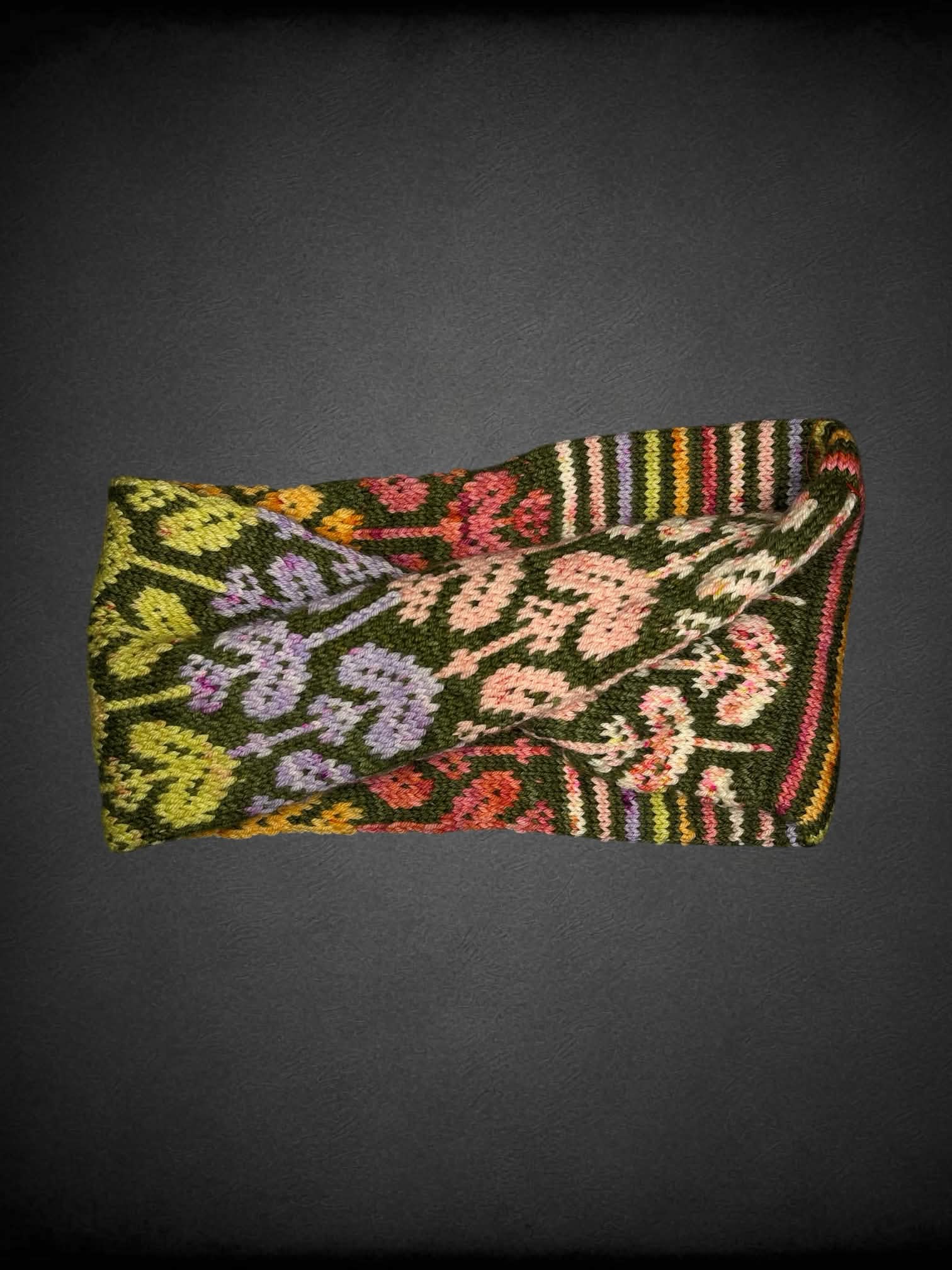 Colorful knit infinity scarf with stripes and flower design