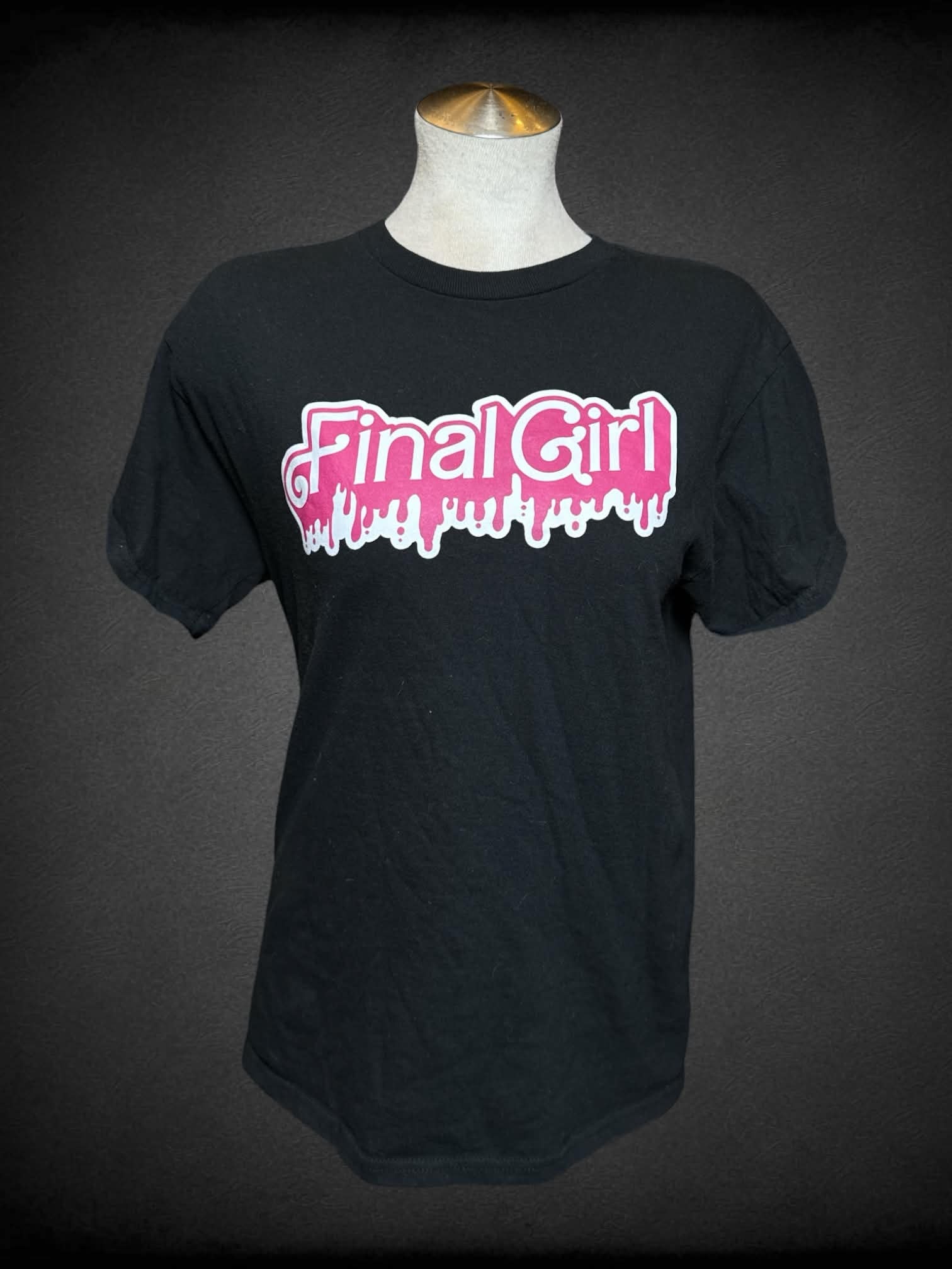 L Gildan black t shirt with “Final Girl” Barbie font logo on front