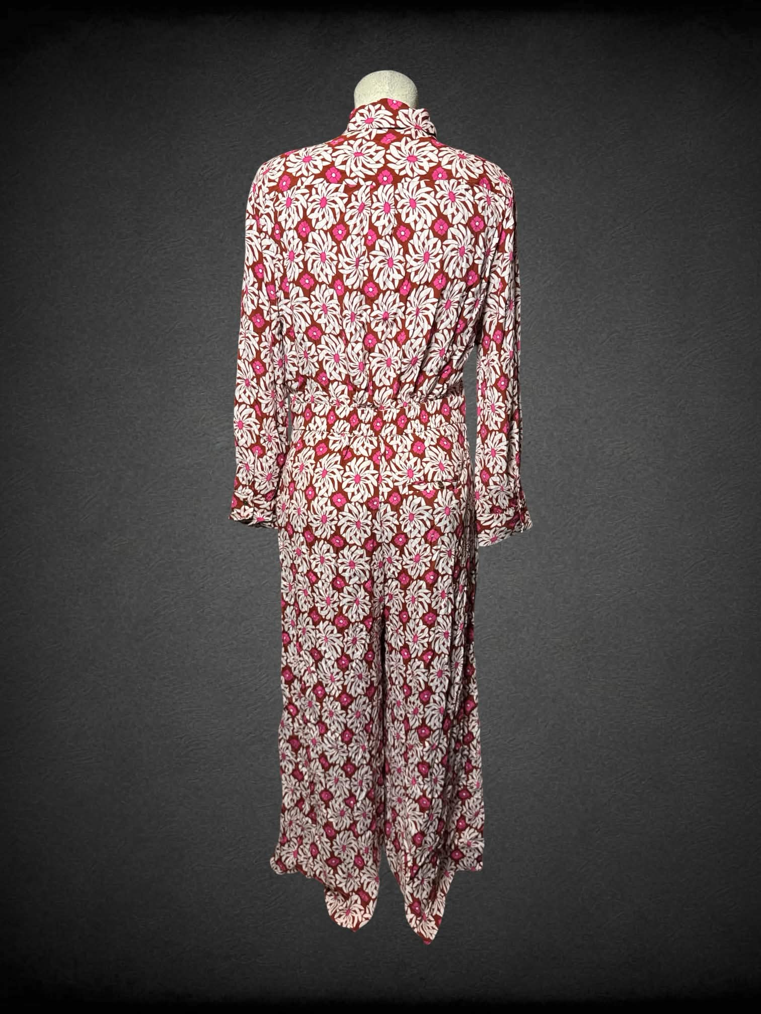 L Anthropologie white jumpsuit with pink & brown 70’s style ornamental design and pockets