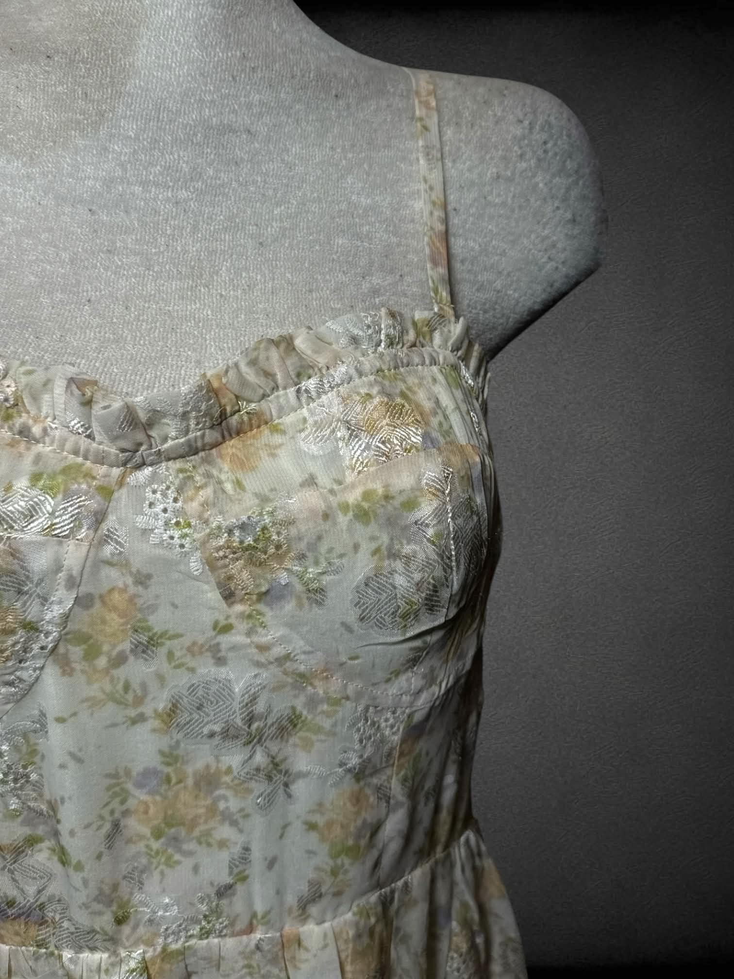 L Storia beige sundress with pastel floral pattern,removable straps, and zipper on back