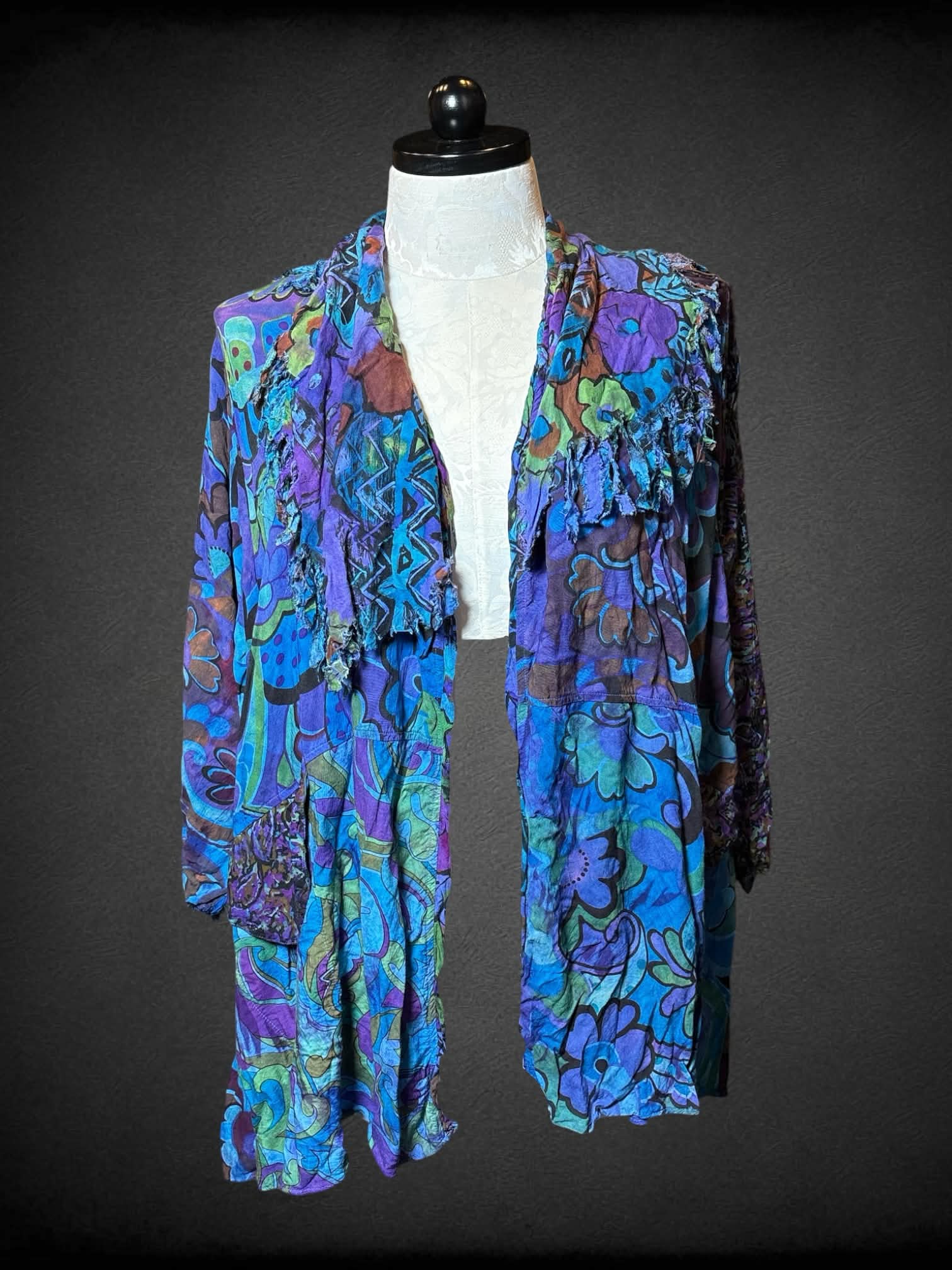 1X URU blue cardigan with purple & green paisley/floral pattern, and pockets on front