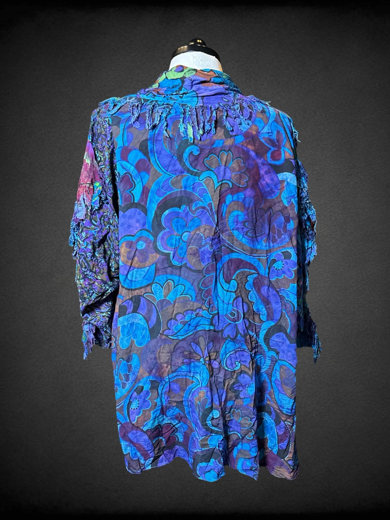 1X URU blue cardigan with purple & green paisley/floral pattern, and pockets on front