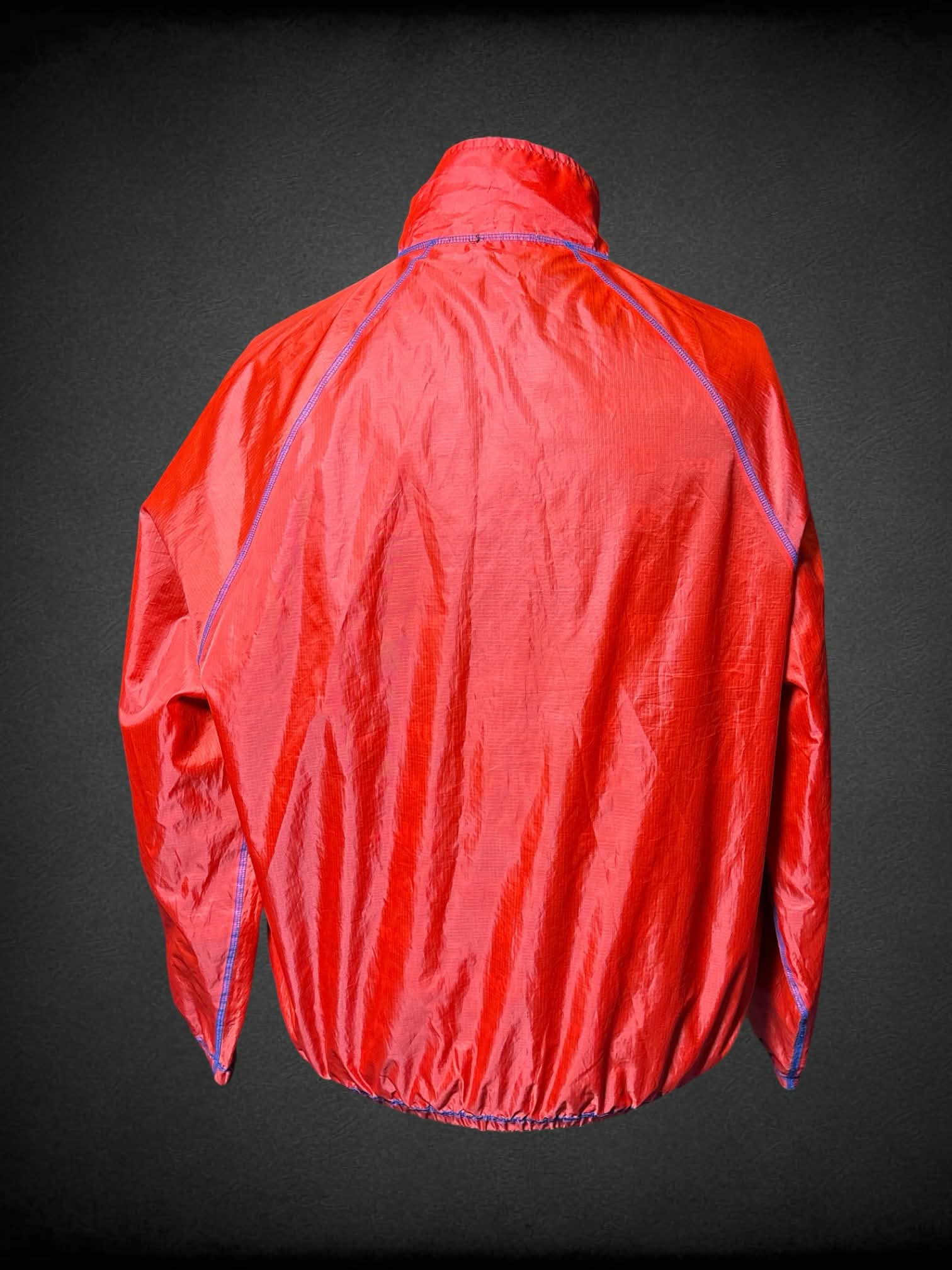 3X Wilson red reversable windbreaker, with blue “Wilson” pattern inside