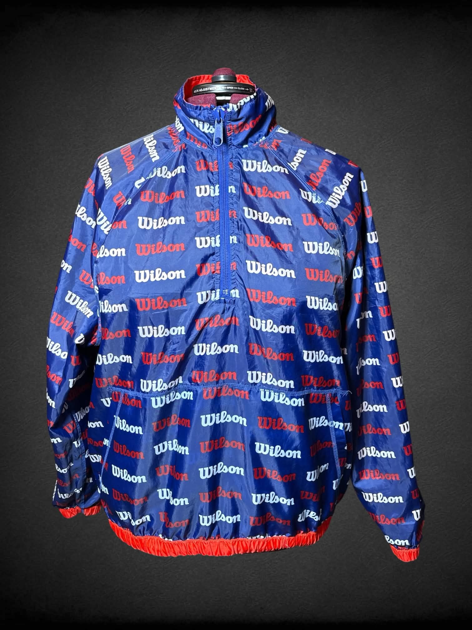 3X Wilson red reversable windbreaker, with blue “Wilson” pattern inside