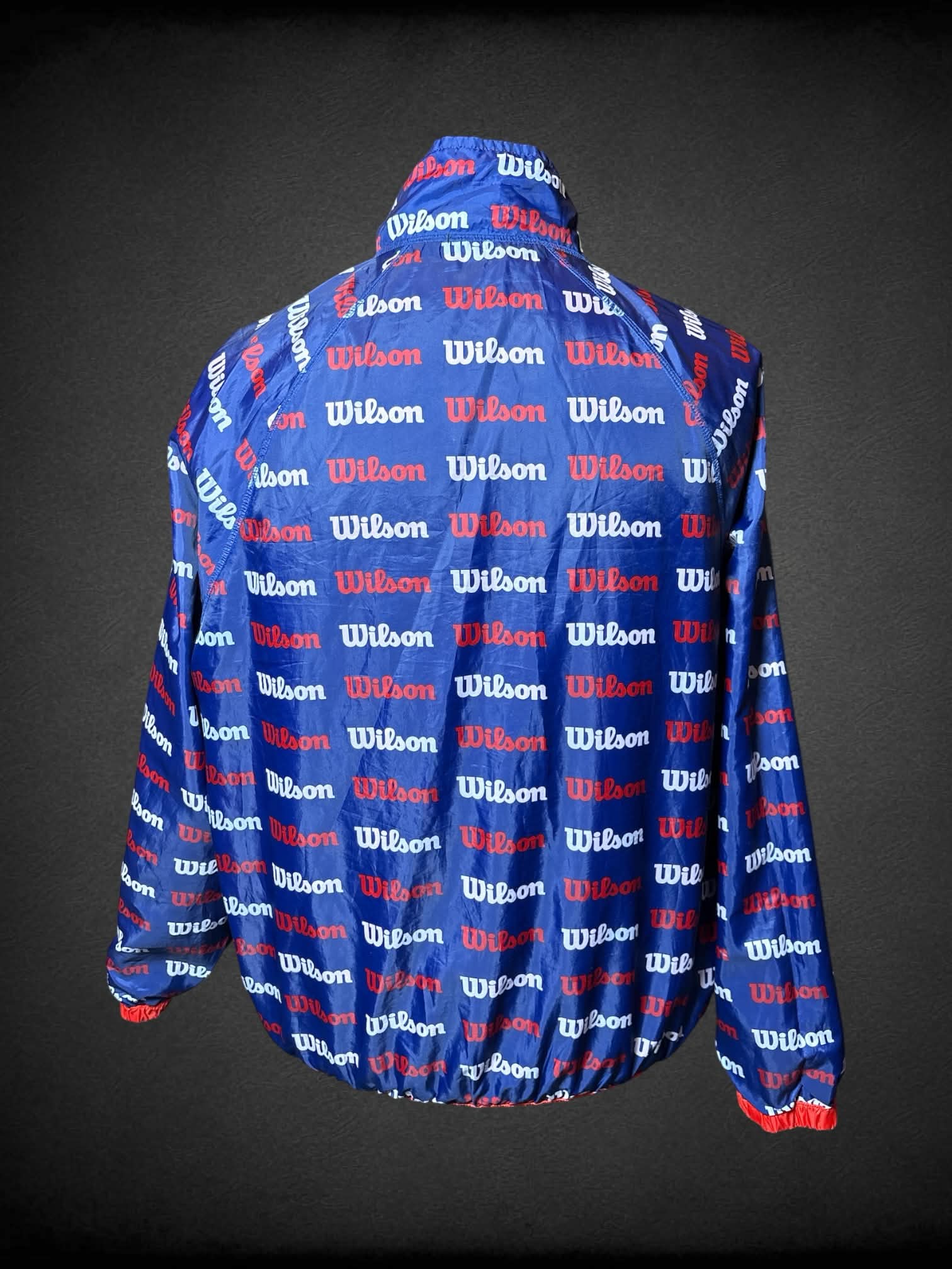 3X Wilson red reversable windbreaker, with blue “Wilson” pattern inside