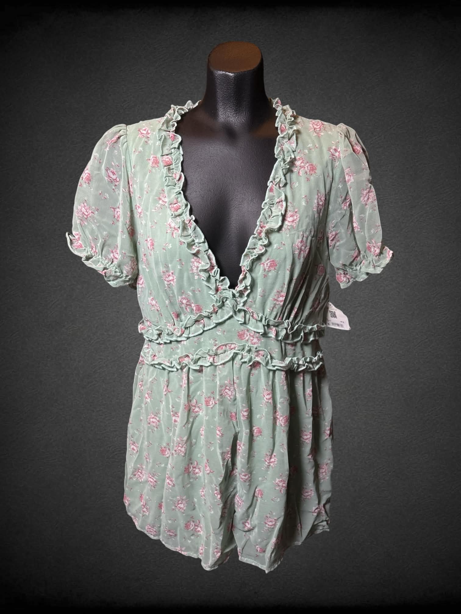 M Altar’d State NWT sage green jumpsuit with ruffle neckline, pink floral pattern, and zipper on back