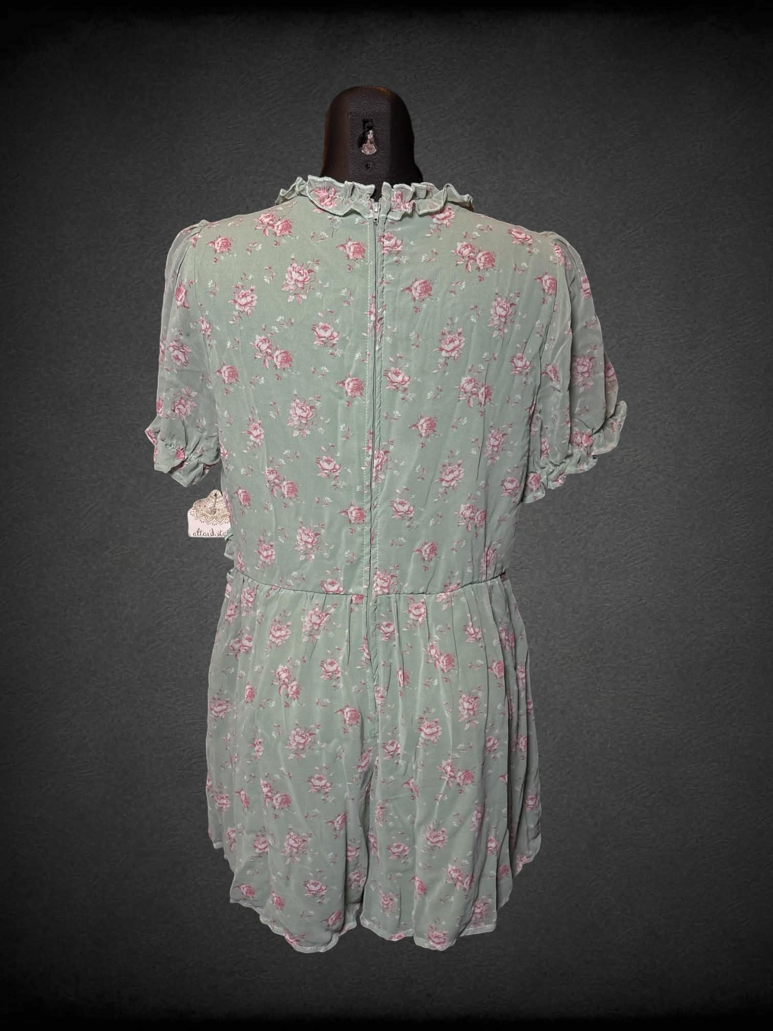 M Altar’d State NWT sage green jumpsuit with ruffle neckline, pink floral pattern, and zipper on back