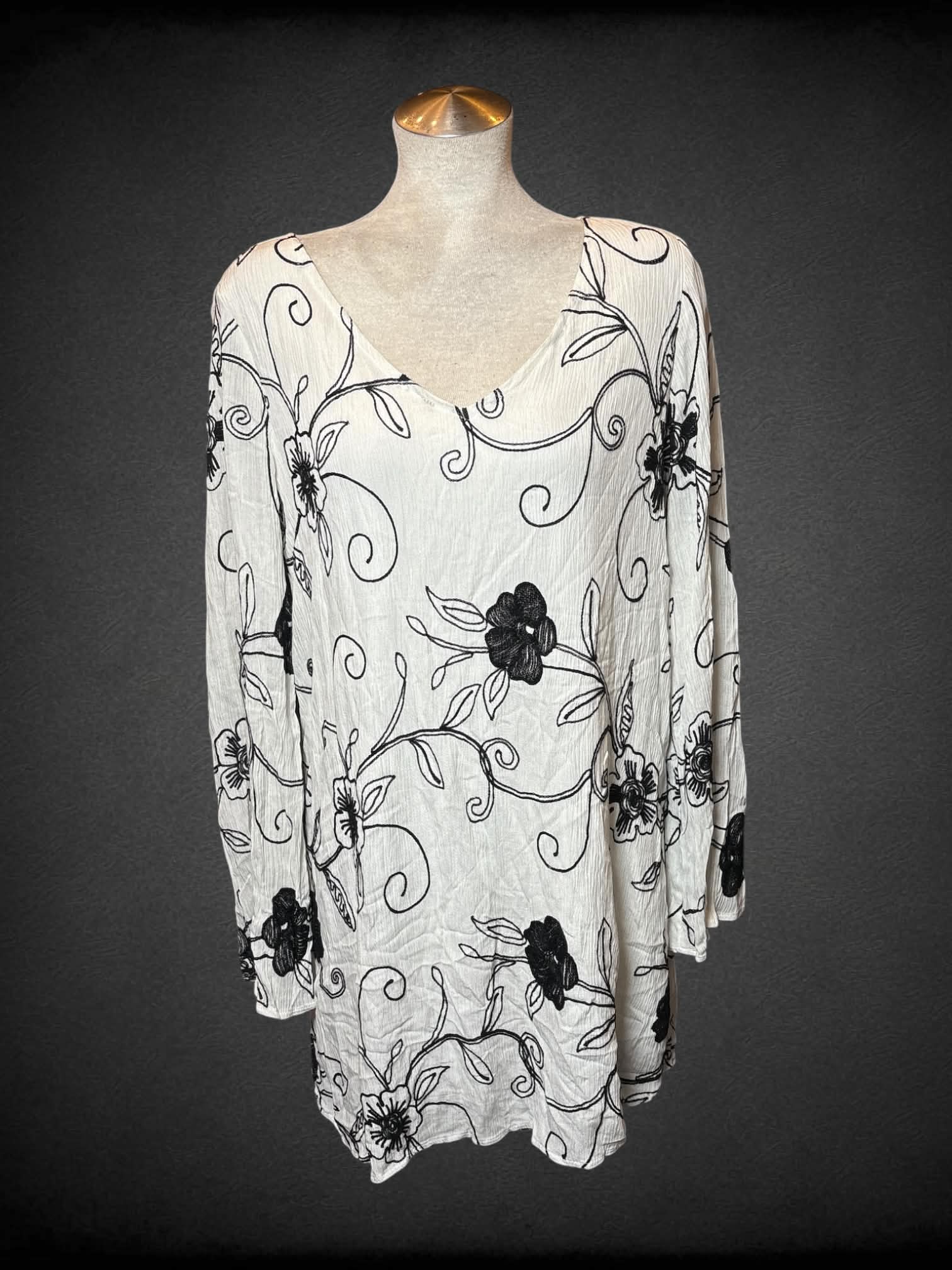L Rokoko by Dazz white longsleeve dress with black woven flower design, and button on pack