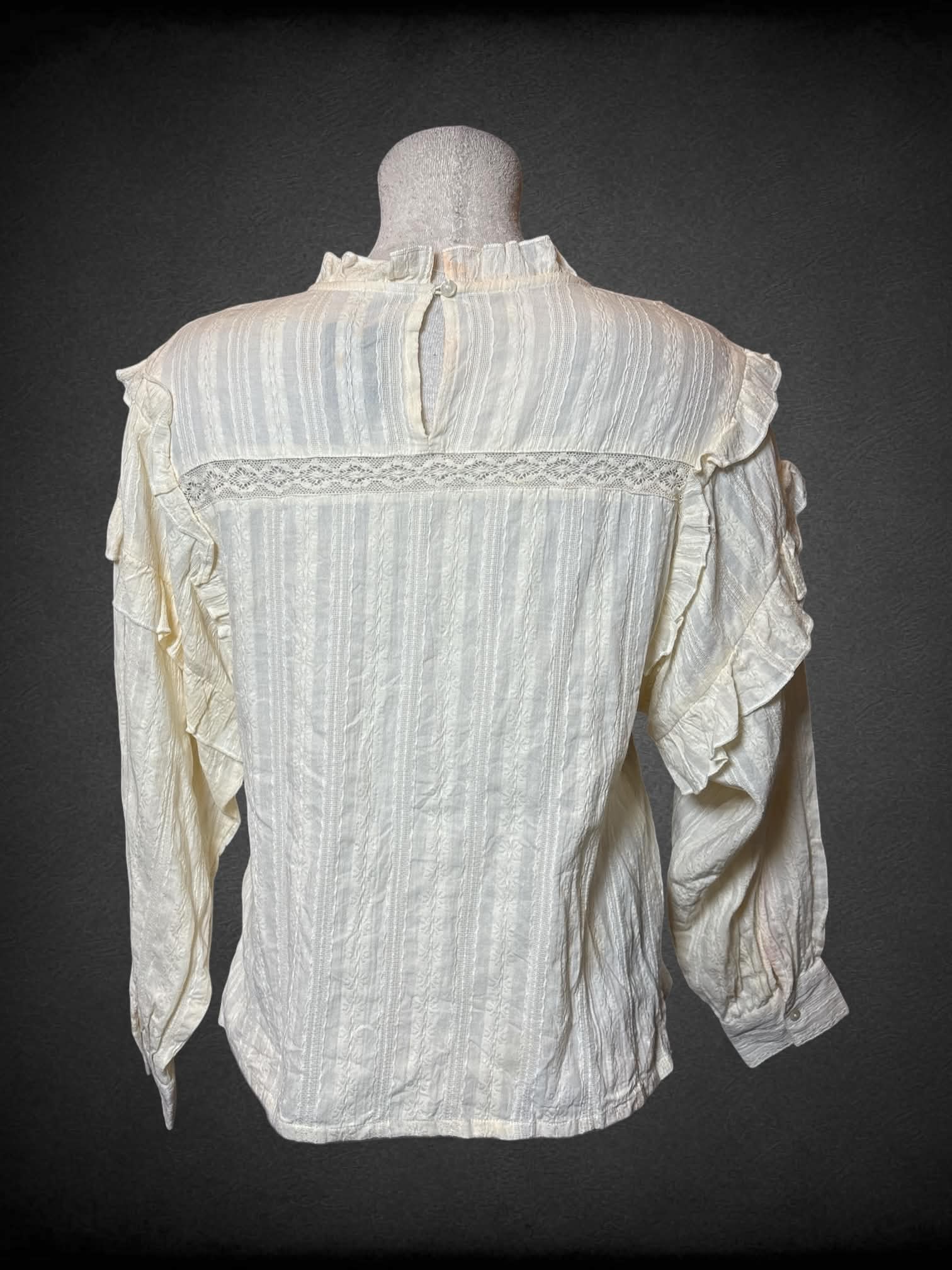 L MNG off-white prairie button-up shirt with lace detailing, and ruffled sleeves