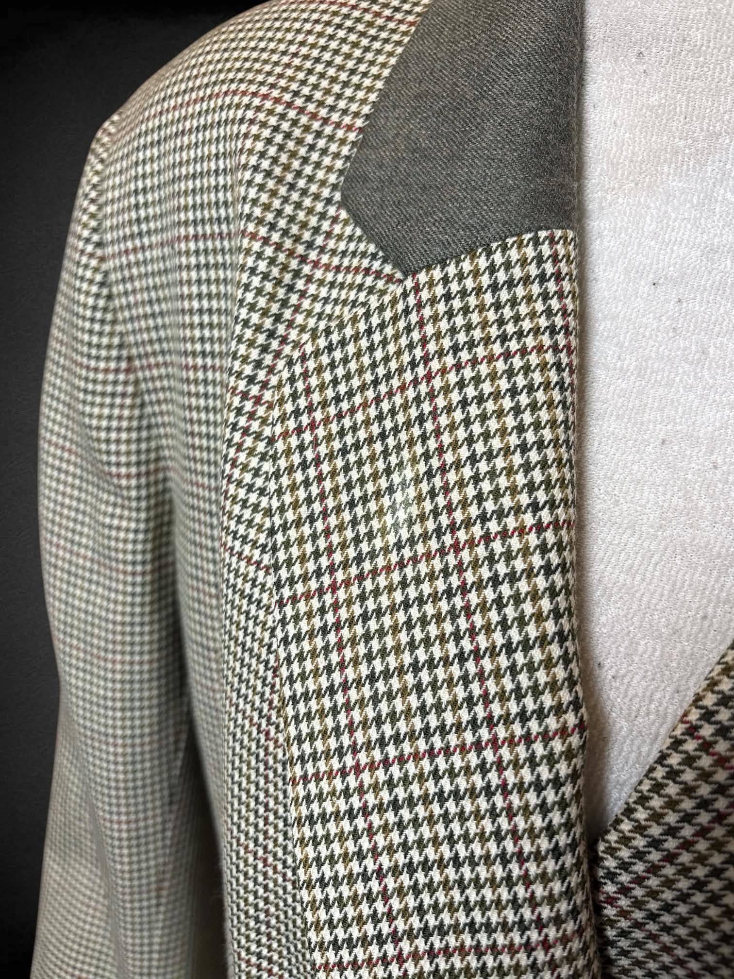 L JH Collectibles vintage olive green jacket with padded shoulders, and houndstooth pattern