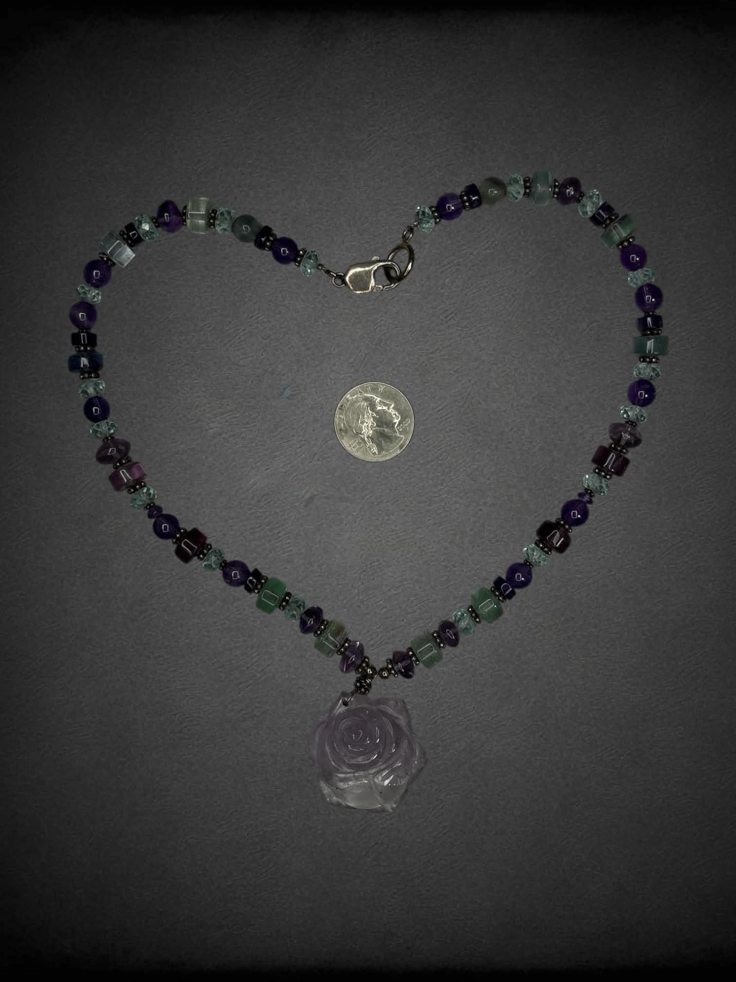 Purple beaded necklace with rose charm