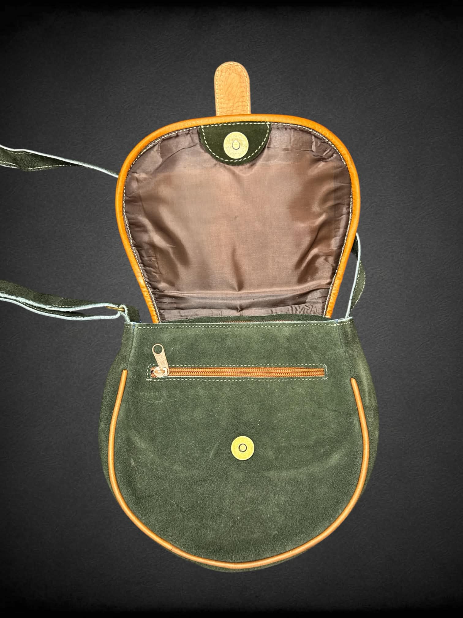 Green suede shoulder bag with embroidered flower design, and zipper pockets on front & back