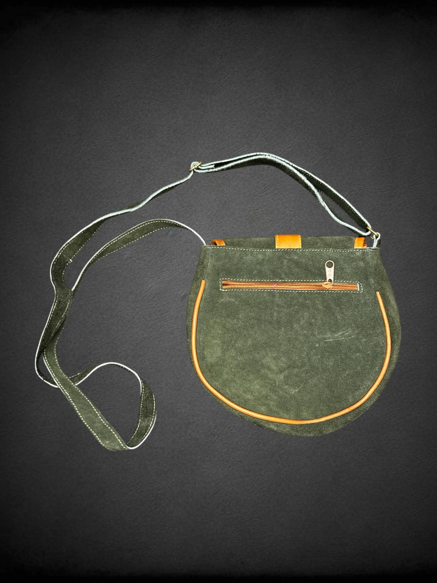 Green suede shoulder bag with embroidered flower design, and zipper pockets on front & back